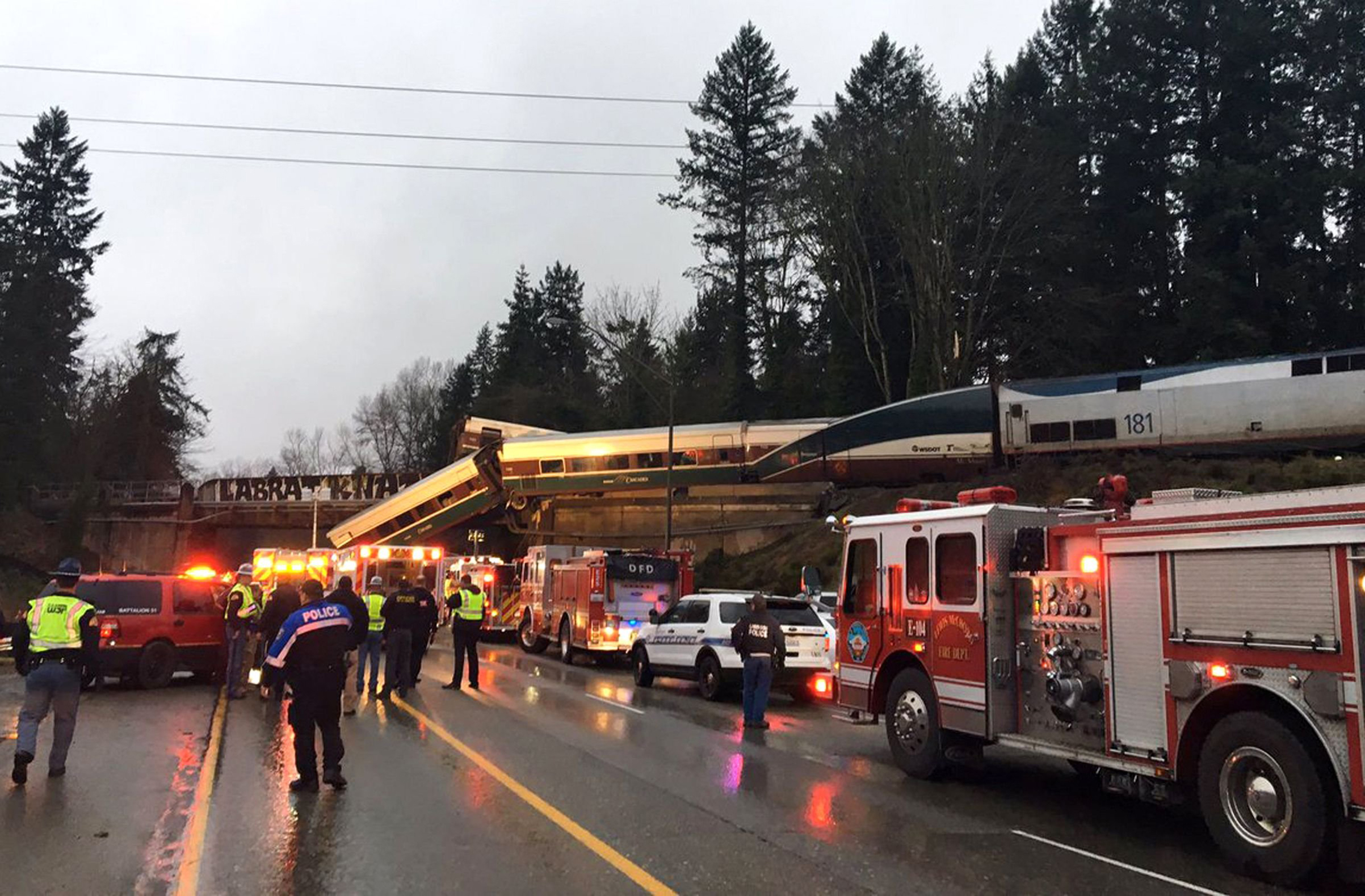 An Amtrak train that was derailed south of Seattle on Dec. 18, 2017. Authorities reported "injuries and casualties." The train derailed about 40 miles (64 kilometers) south of Seattle before 8 a.m., spilling at least one train car on to busy Interstate 5. (Washington State Patrol/AP/Shutterstock)