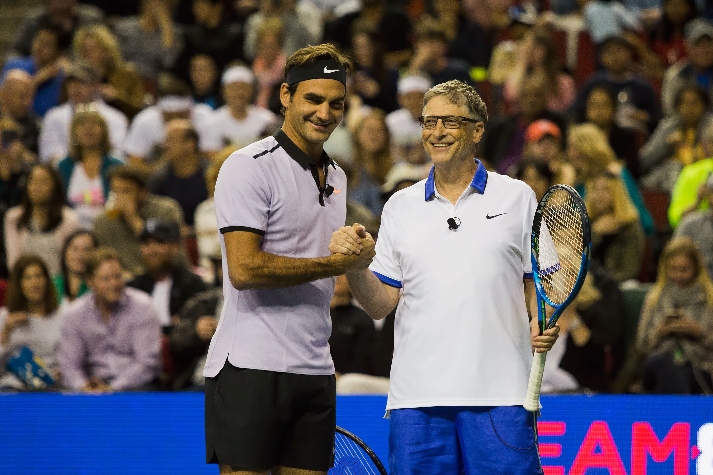 Roger Federer of Switzerland and Bill Gates shake hands at the Match For Africa 4 exhibition match at KeyArena on April 29, 2017 in Seattle, Washington. (Suzi Pratt—Getty Images)