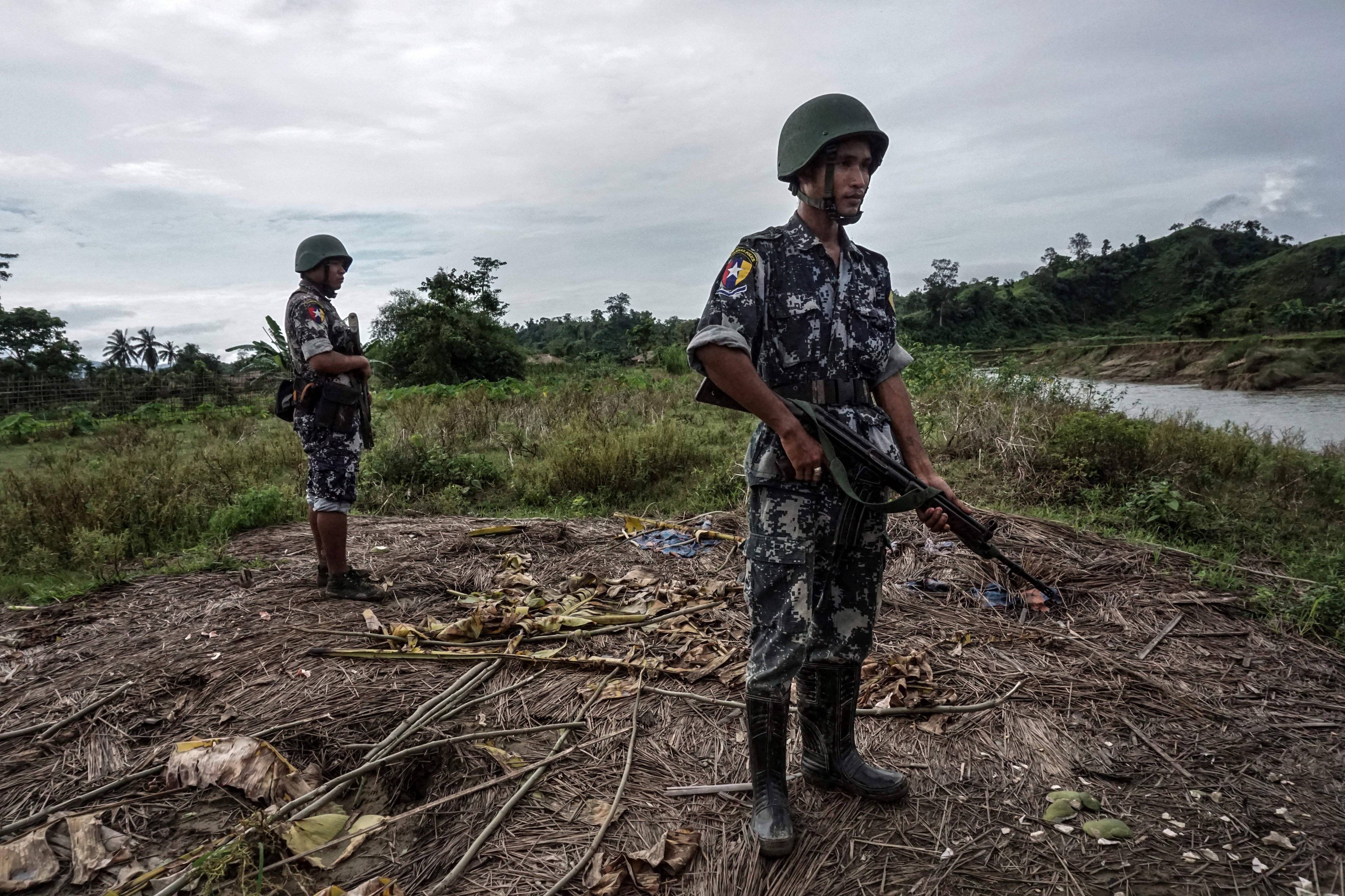 Border police stand guard at Tinmay village, Buthidaung township in Myanmar's northern Rakhine state on July 14, 2017. (Hla Hla Htay—AFP/Getty Images)
