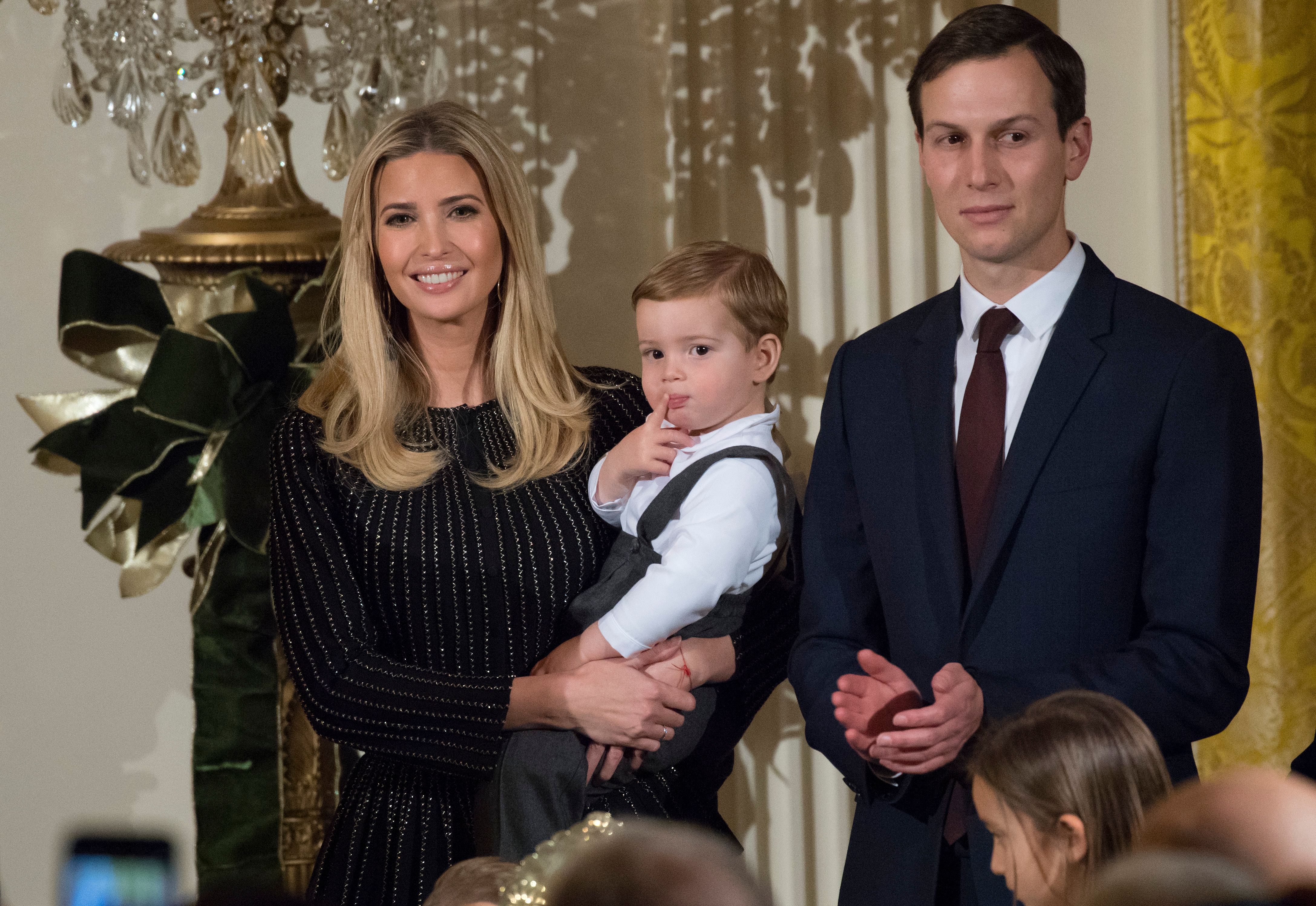 Ivanka Trump holds her son Theodore alongside Jared Kushner attends a Hanukkah reception (SAUL LOEB - AFP/Getty Images)