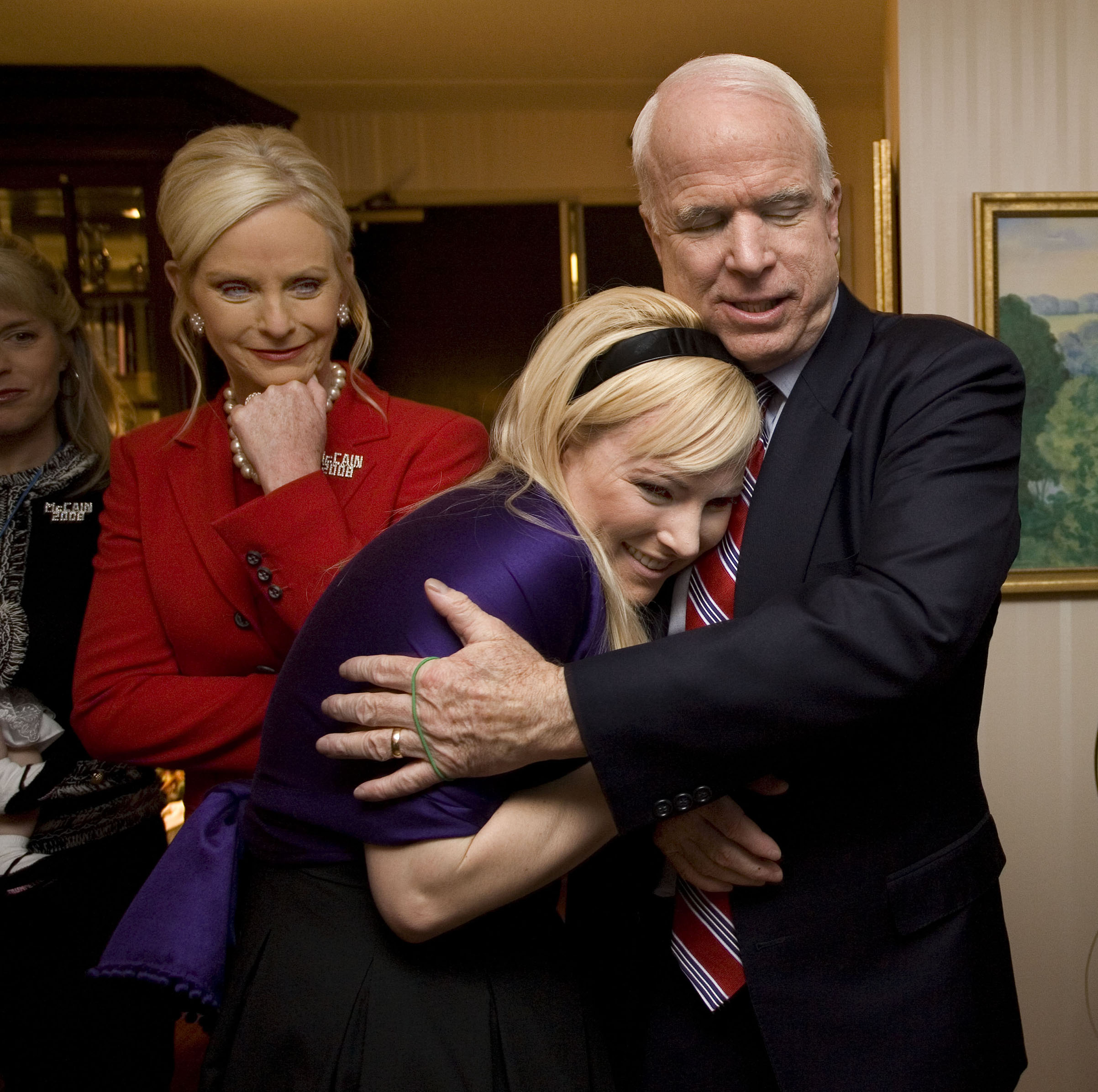 In his suite at the Crown Plaza Hotel, Republican Presidential contender Senator John McCain hugs his daughter Meghan McCain, with his wife Cindy McCain behind them, on Jan. 8, 2008 in Nashua, N.H. (David Hume Kennerly—Getty Images)