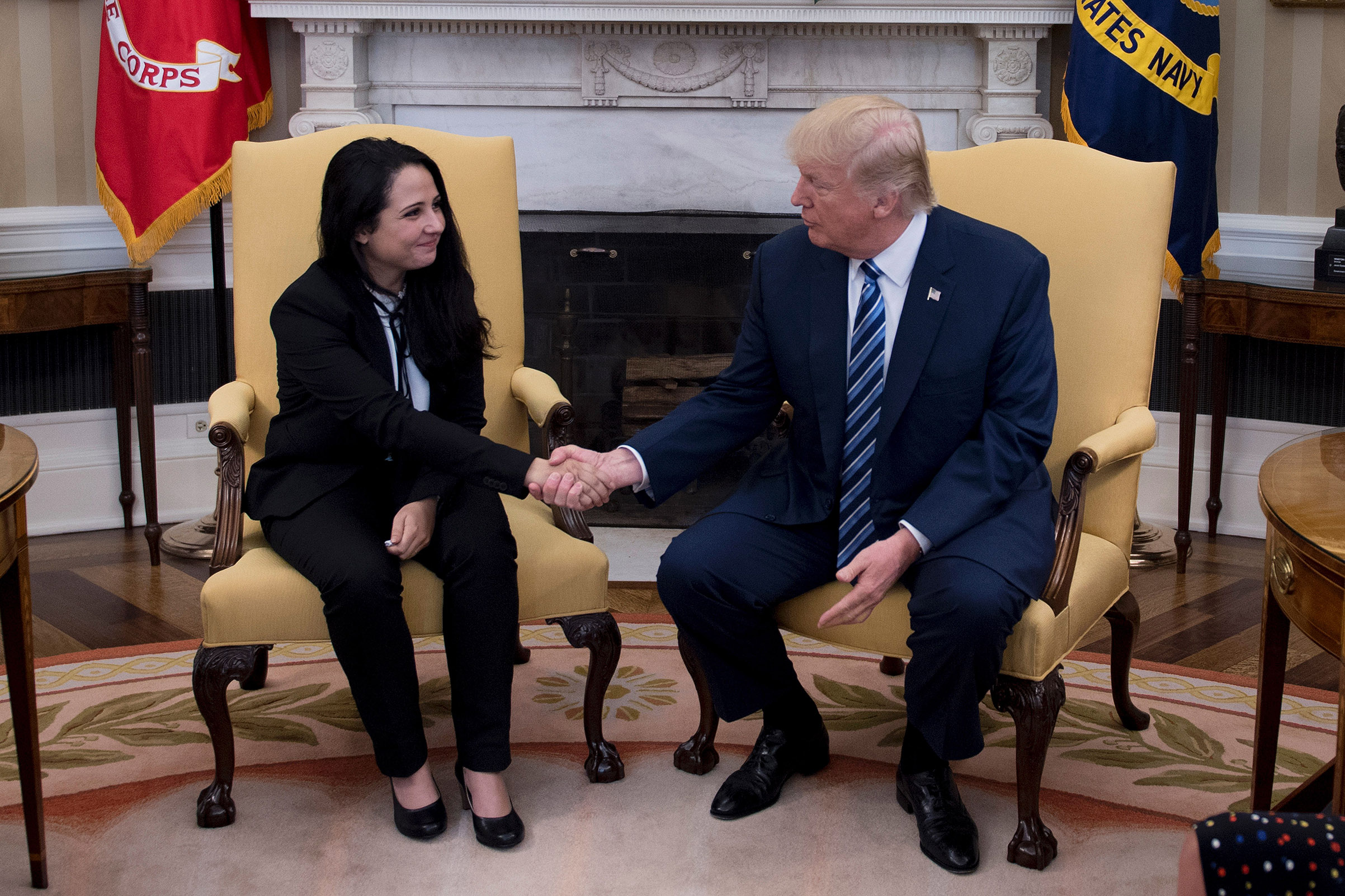 President Donald Trump shakes hands with Aya Hijazi, an Egyptian-American aid worker at the White House in Washington, DC, on April 21, 2017. (Jim Watson—AFP/Getty Images)
