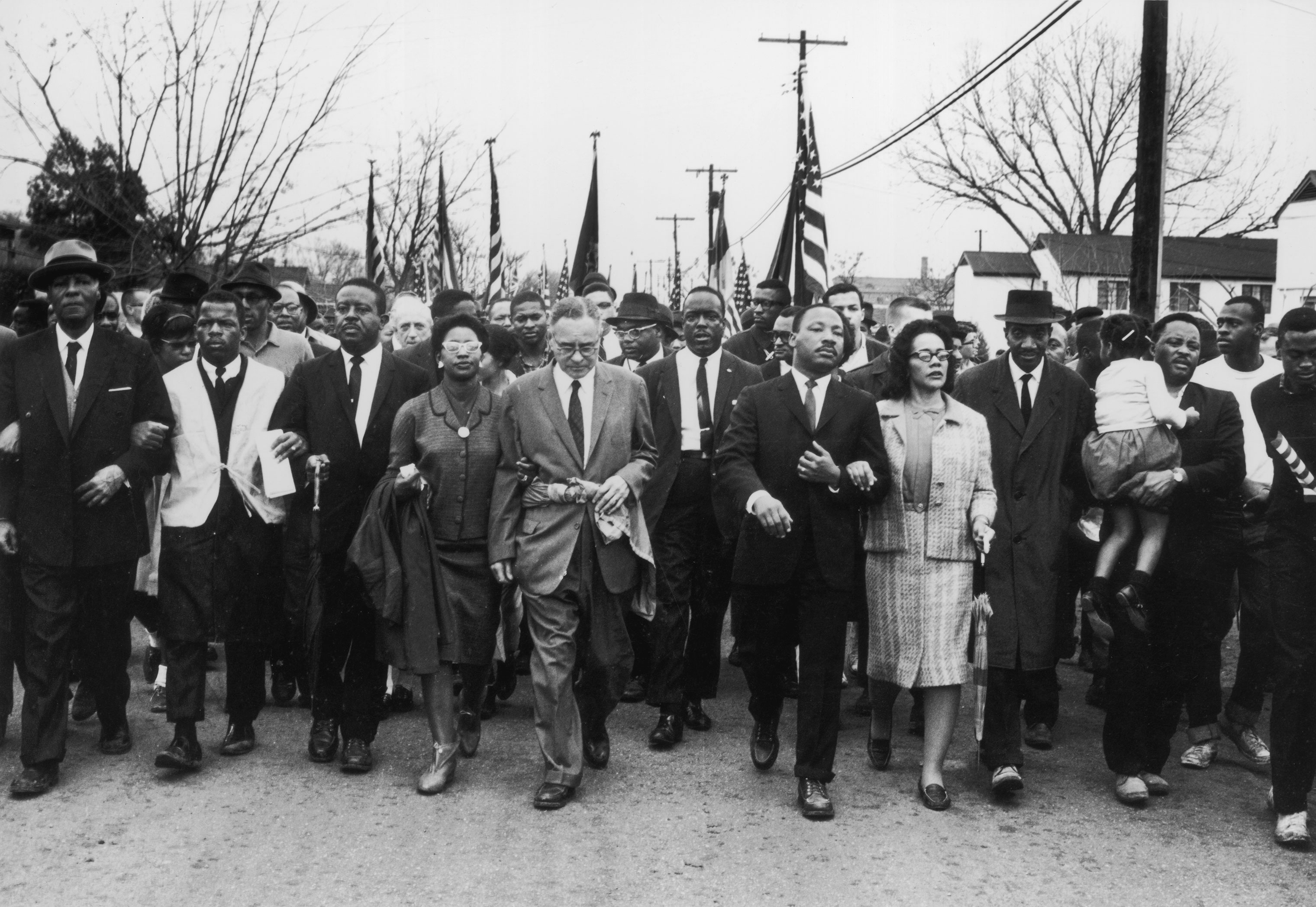 John Lewis (second from left) joins American civil rights campaigner Martin Luther King Jr. and his wife Coretta Scott King in a march from Selma, Alabama, to the state capital in Montgomery, March 30, 1965. (William Lovelace/Express—Getty Images)