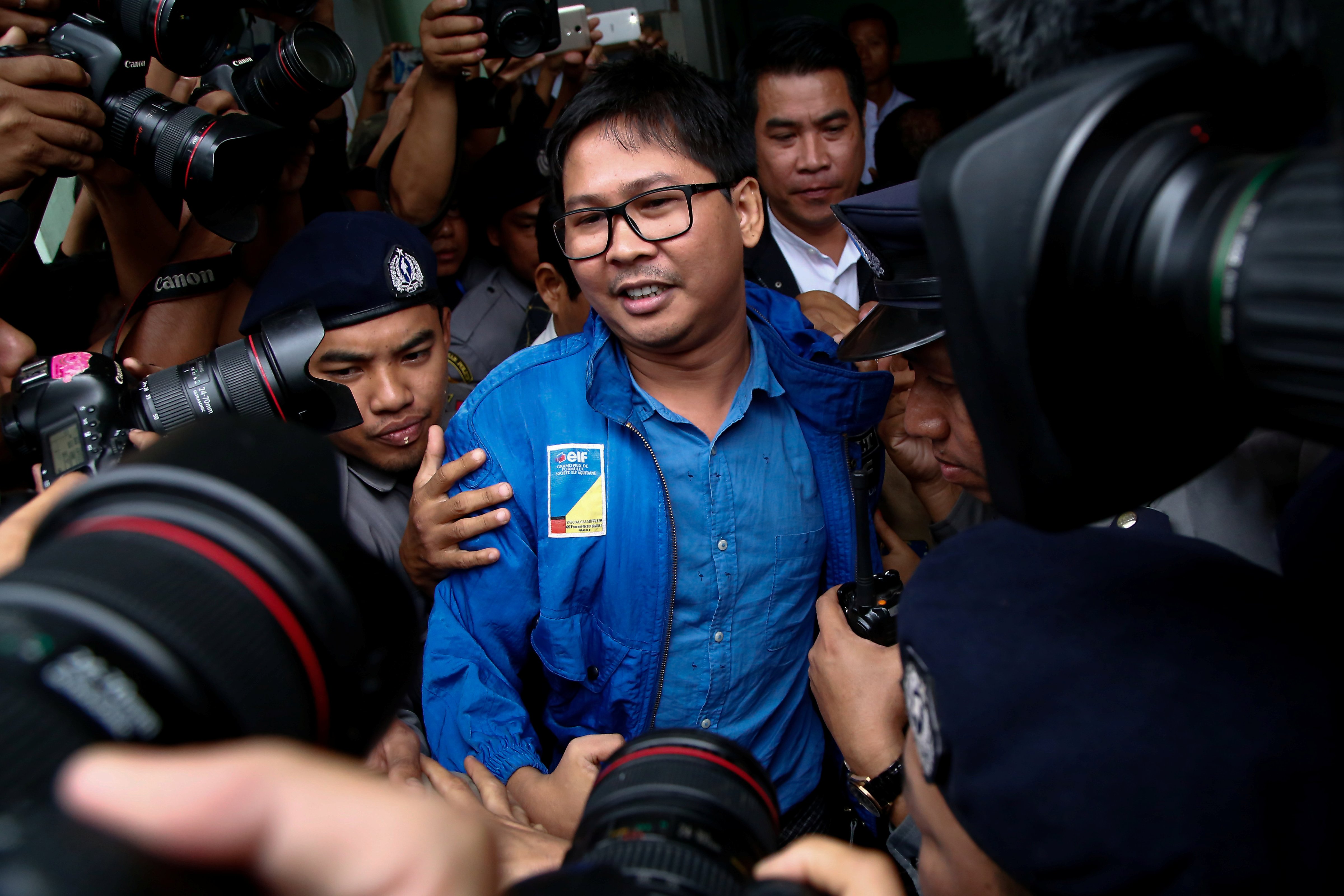 Reuters reporter Wa Lone talks to reporters as he leaves court in Yangon