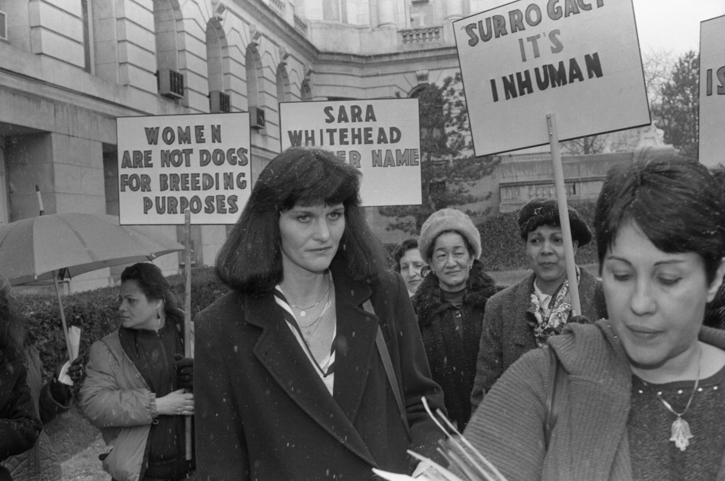 Surrogate mother Mary Beth Whitehead joins a group of women demonstrating on her behalf outside Bergen County courthouse on March 12, 1987, after the lawyers in the 