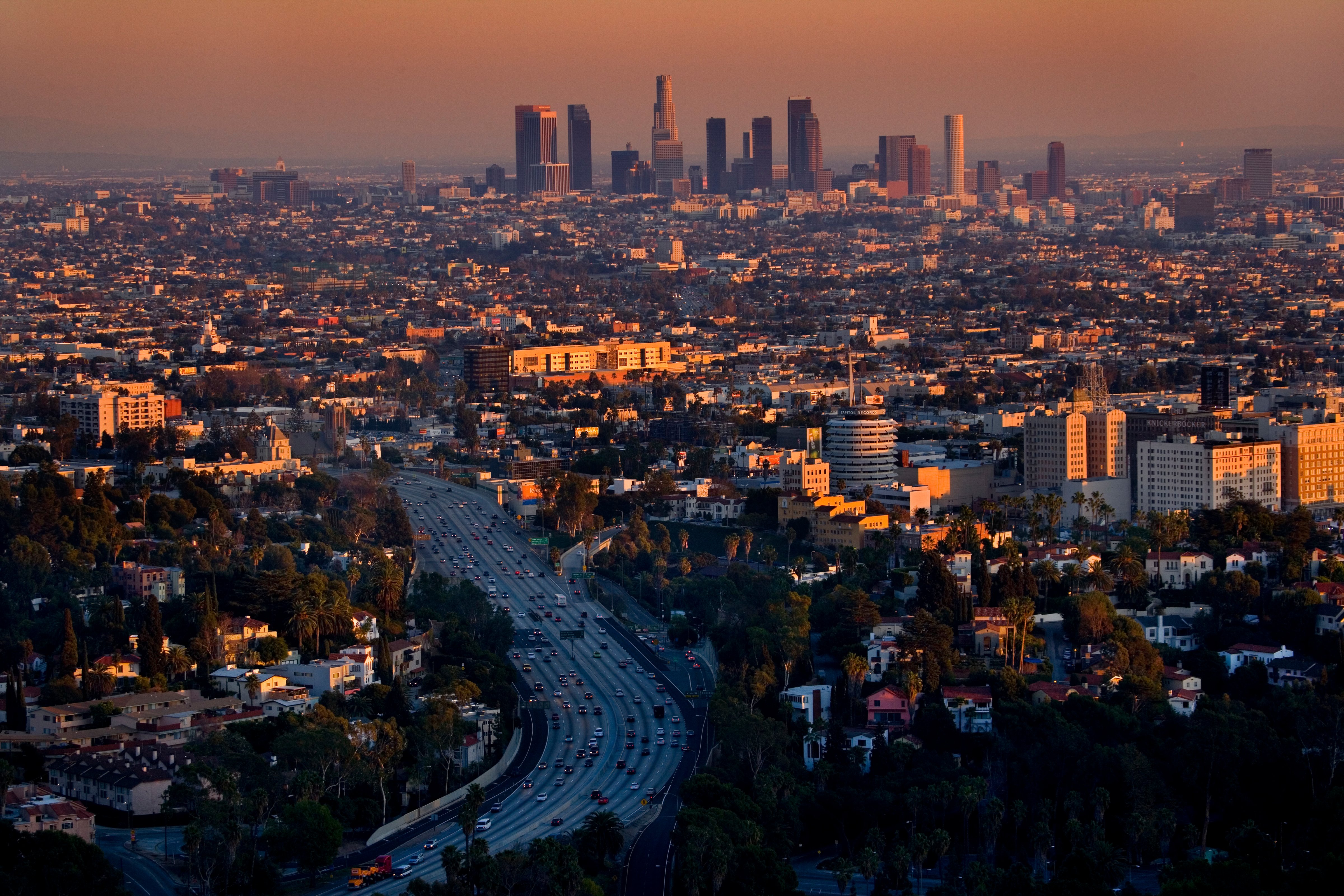View of Los Angeles at dusk taken from Beverly Hills, Mulholland Drive. The high rise offices of downtown are in the background, Hollywood in the foreground. (Barry Lewis—Corbis/Getty Images)