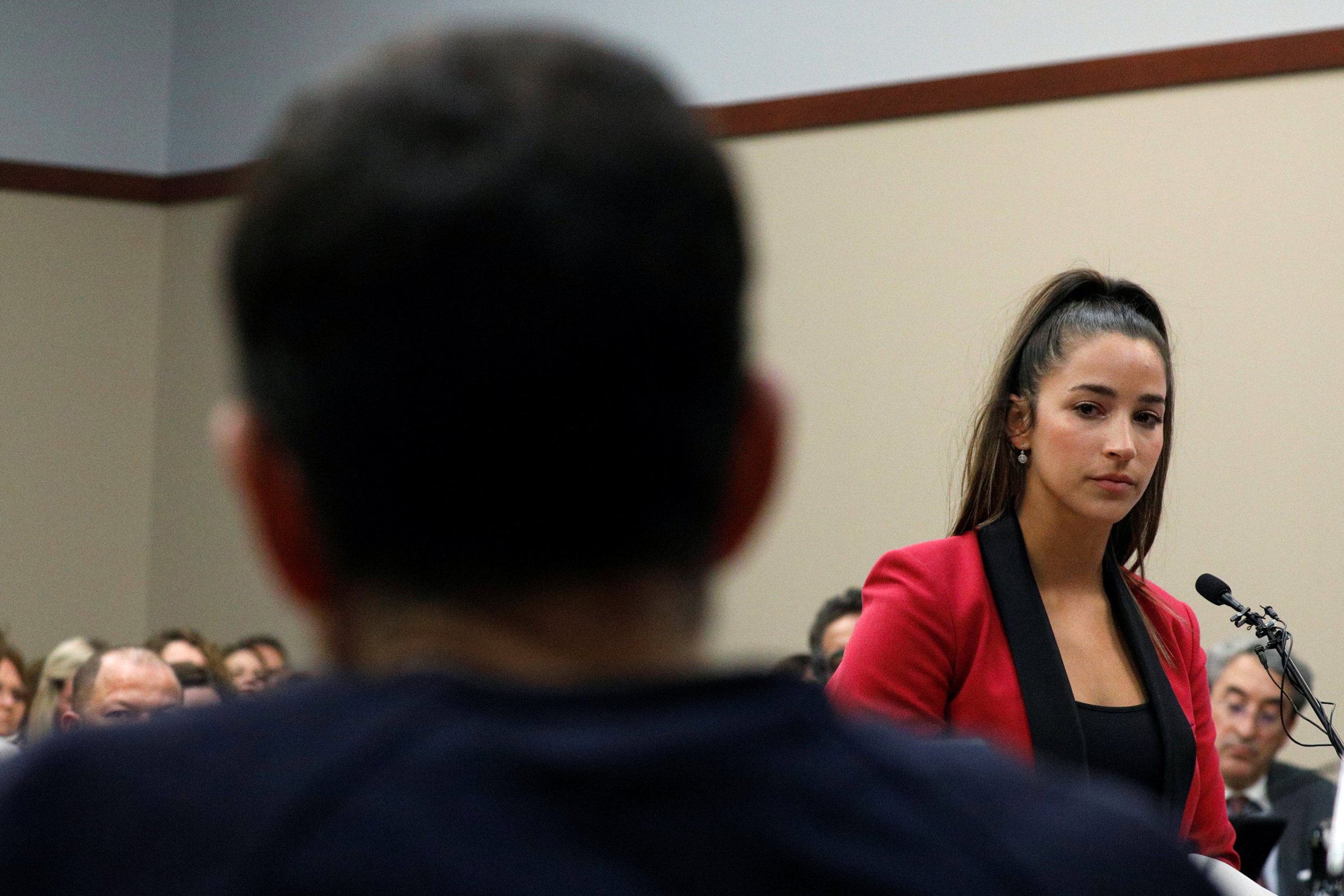 Victim and gymnast Aly Raisman speaks at the sentencing hearing for Larry Nassar, (R) a former team USA Gymnastics doctor who pleaded guilty in November 2017 to sexual assault charges, in Lansing