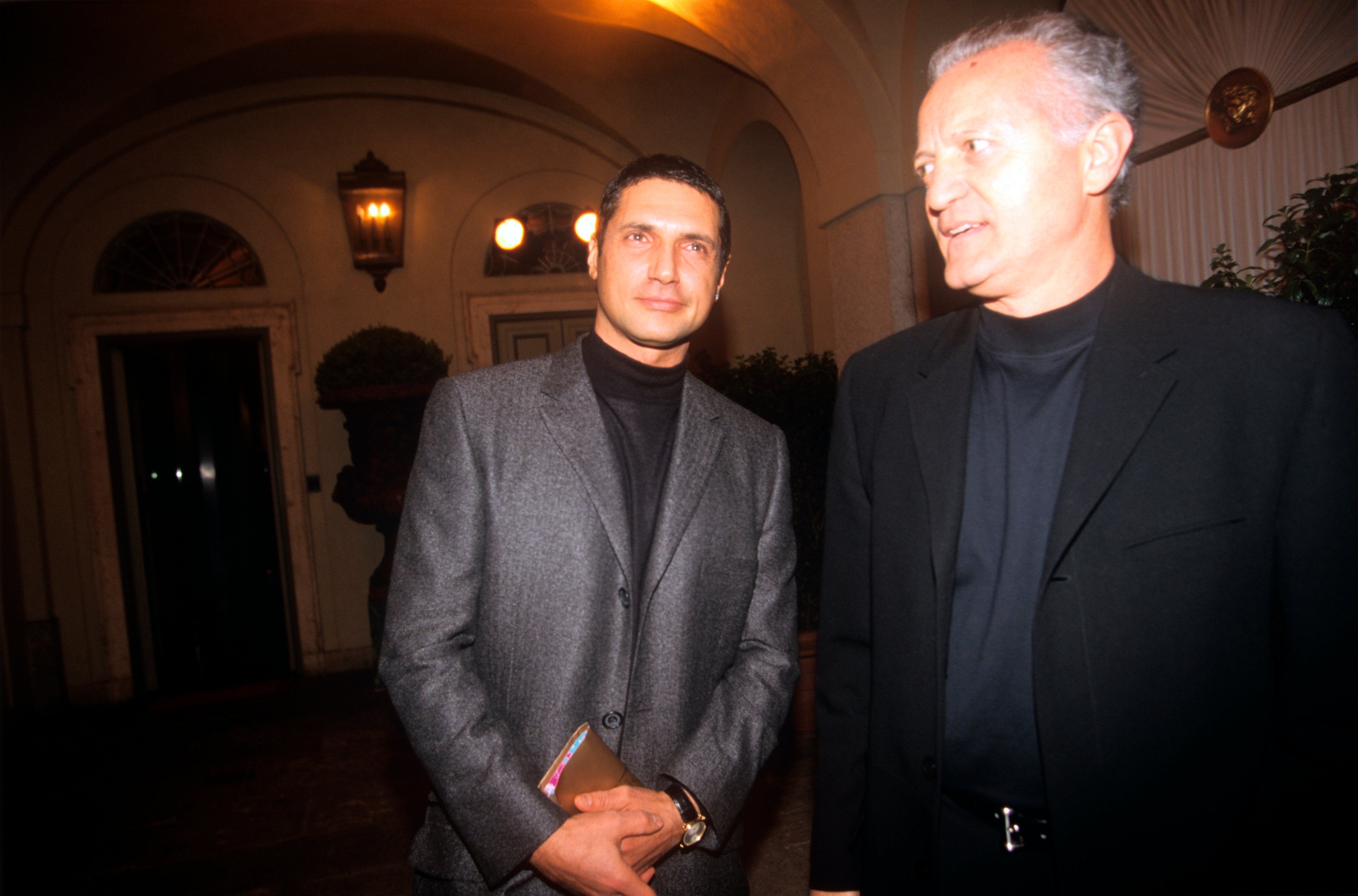 From the left, the fashion designer Antonio D'Amico and Santo Versace, respectively the former partner and the elder brother of the deceased Gianni Versace, are awaiting the beginning of the fashion show dedicated to the spring/summer collection at the via Gesù seat. Milan (Italy), 6th March 1998. (Mondadori Portfolio—Mondadori via Getty Images)