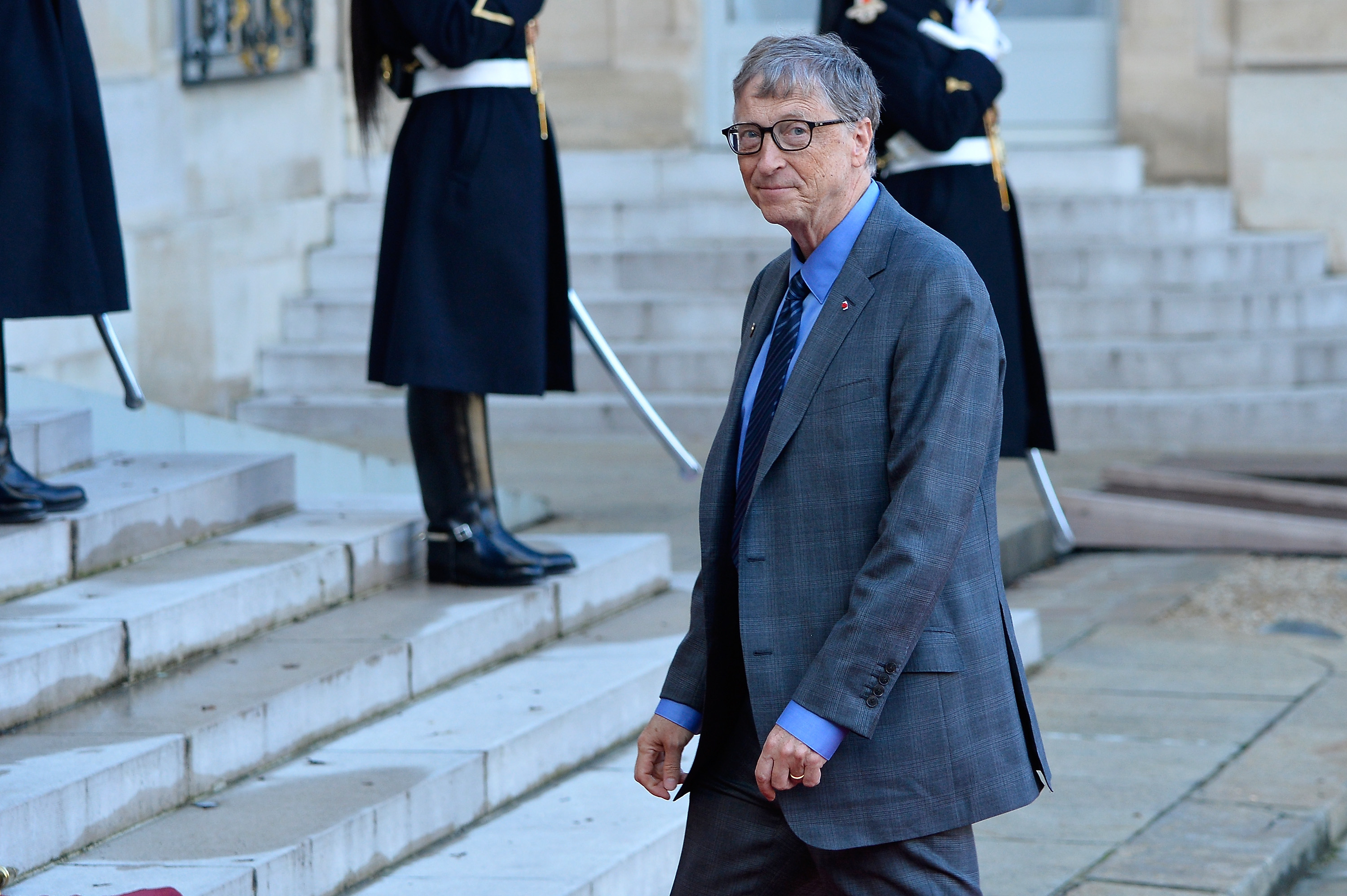 Bill Gates arrives for a meeting with French President Emmanuel Macron as he receives the One Planet Summit's international leaders at Elysee Palace on December 12, 2017 in Paris, France. Macron is hosting the One climate summit, which gathers world leaders, philantropists and other committed private individuals to discuss climate change. (Aurelien Meunier—Getty Images)