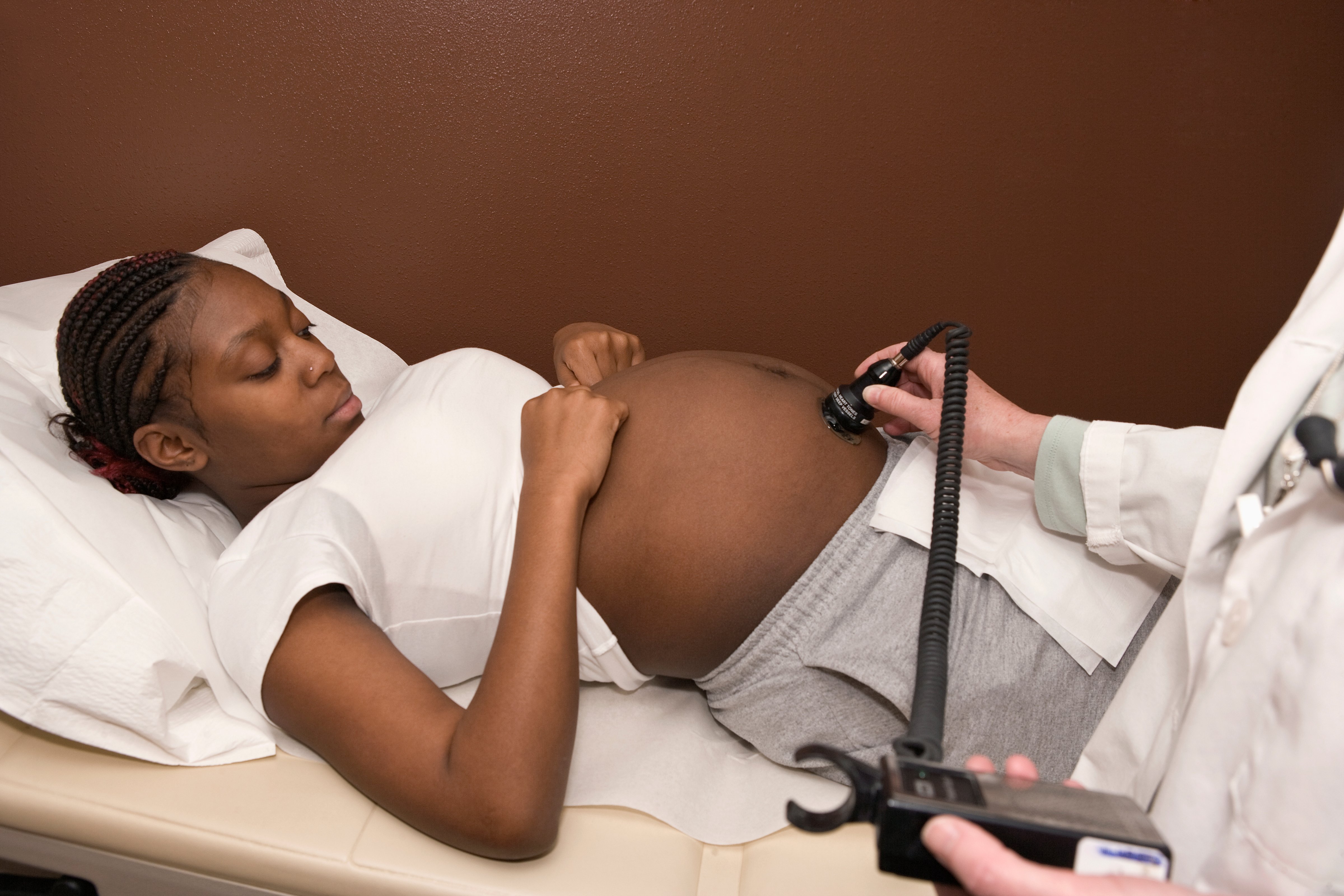 A pregnant woman receiving an ultrasound
