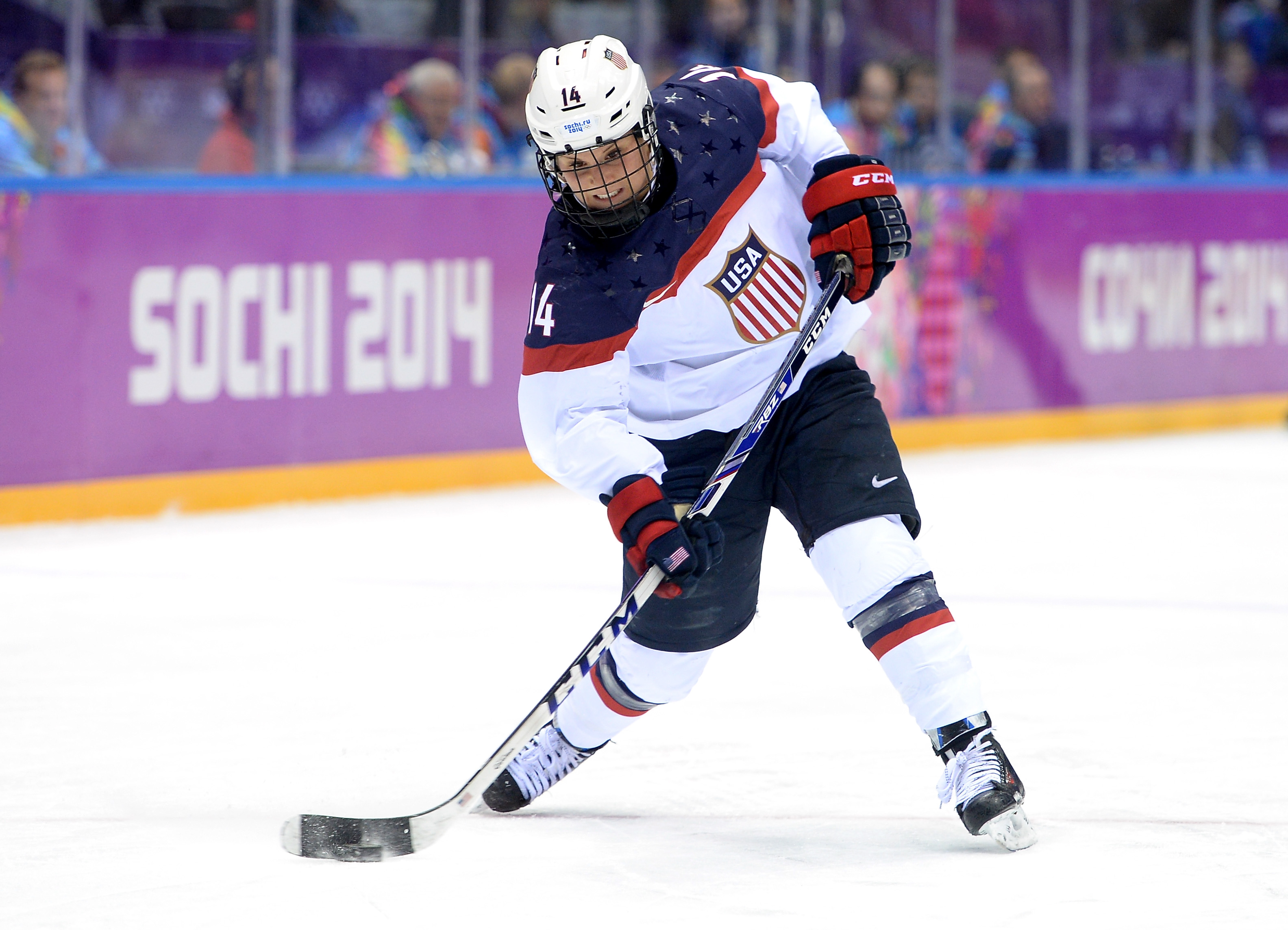 Brianna Decker #14 of the United States handles the puck against Canada during the Ice Hockey Women's Gold Medal Game on day 13 of the Sochi 2014 Winter Olympics at Bolshoy Ice Dome on February 20, 2014 in Sochi, Russia. (Photo by Harry How/Getty Images) (Harry How—Getty Images)
