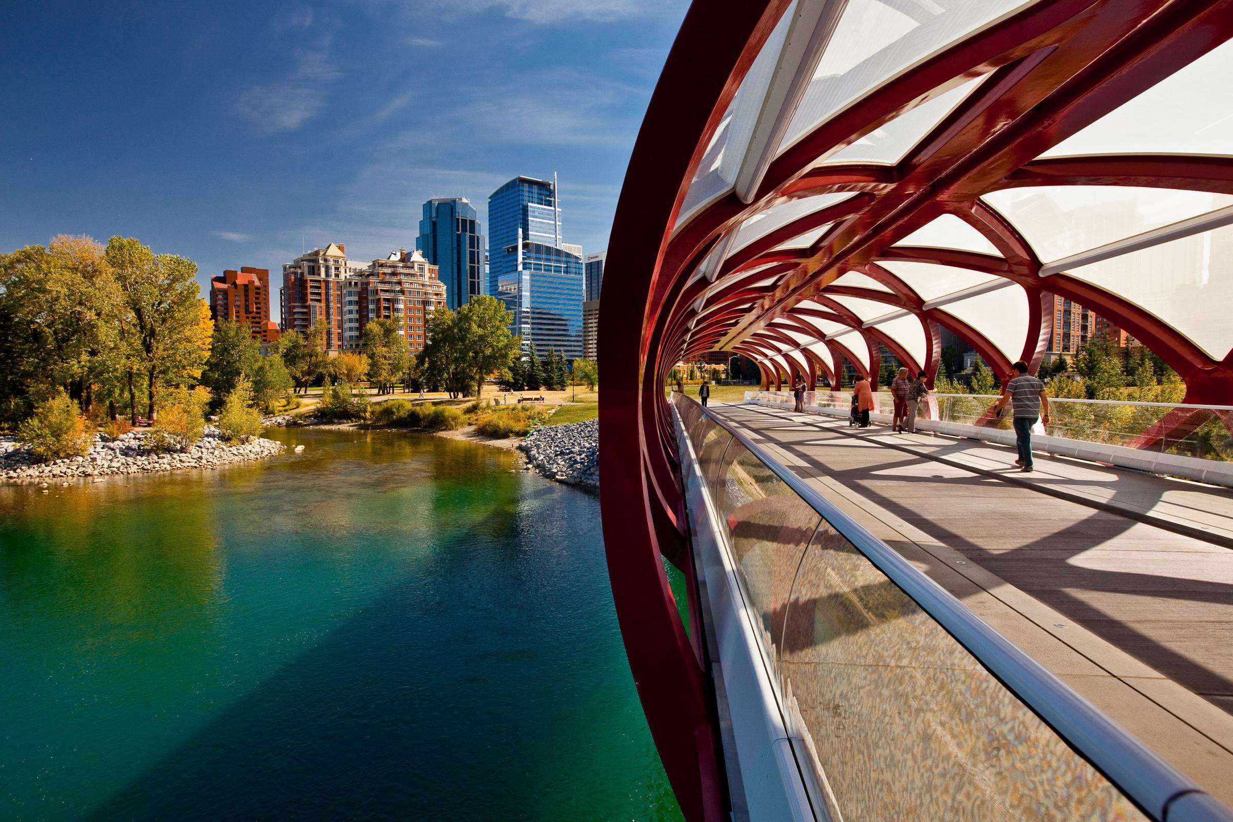 Calgary Peace Bridge and downtown highrise buildings, (Peace Bridge is a pedestrian bridge, designed by renowned Spanish architect Santiago Calatrava), Calgary, Alberta, Canada.