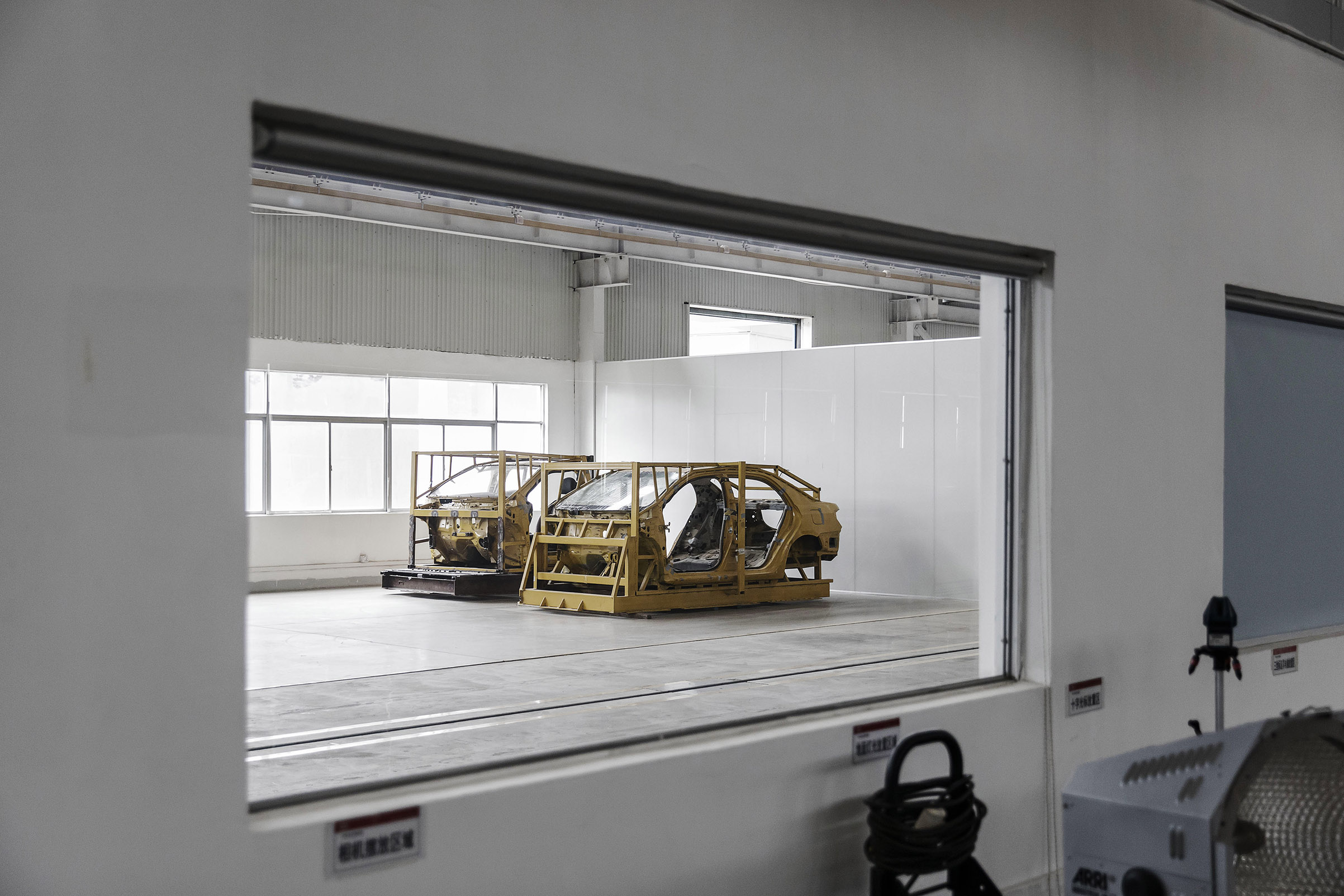 Vehicle frames await testing in leading car­maker BYD’s lab in Shenzhen, China (Qilai Shen—Bloomberg/Getty Images)