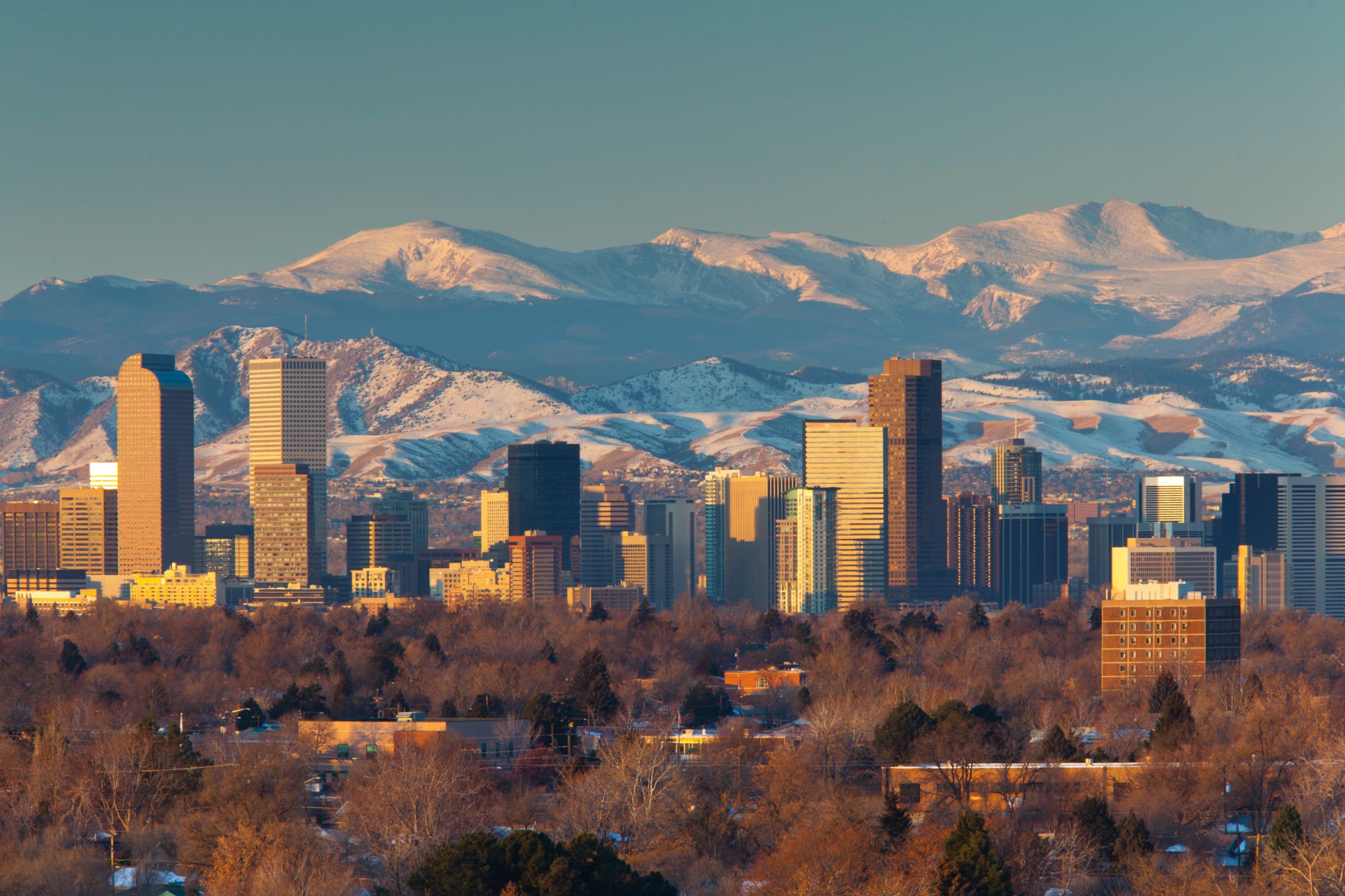 USA, Colorado, Denver, City view and Rocky Mountains from east