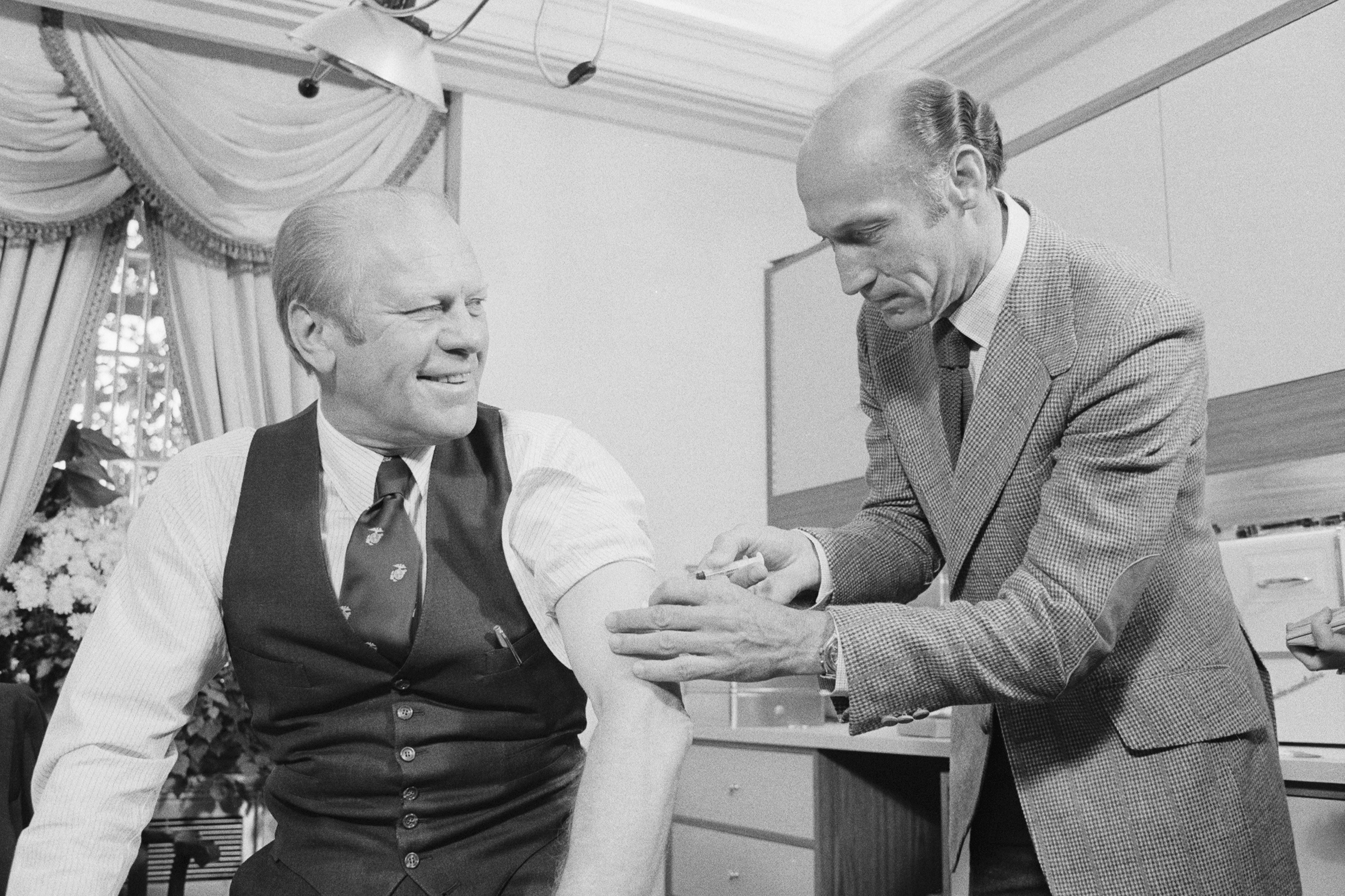 President Ford gets swine flu shot from Wm. Lukash on Oct. 14, 1976. (Bettmann Archive/Getty Images)