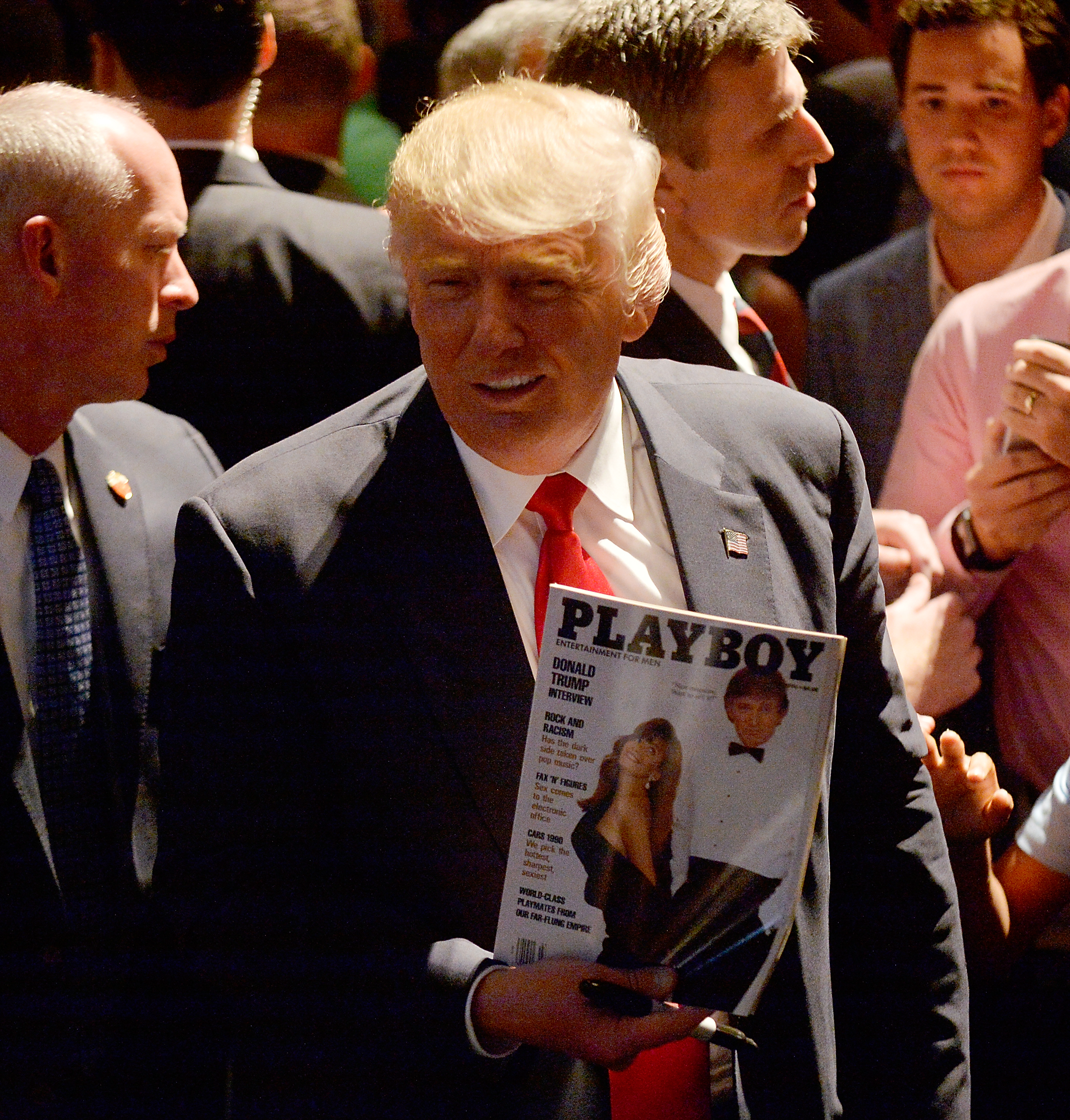 RALEIGH, NC - JULY 5:  Presumptive Republican presidential nominee Donald Trump shows a police officer his photo on the cover of a Playboy magazine during a campaign event at the Duke Energy Center for the Performing Arts  on July 5, 2016 in Raleigh, North Carolina. Earlier in the day Hillary Clinton campaigned in Charlotte, North Carolina with President Barack Obama. (Photo by Sara D. Davis/Getty Images) (Getty Images. Donald Trump on the campaign trail in 2016)
