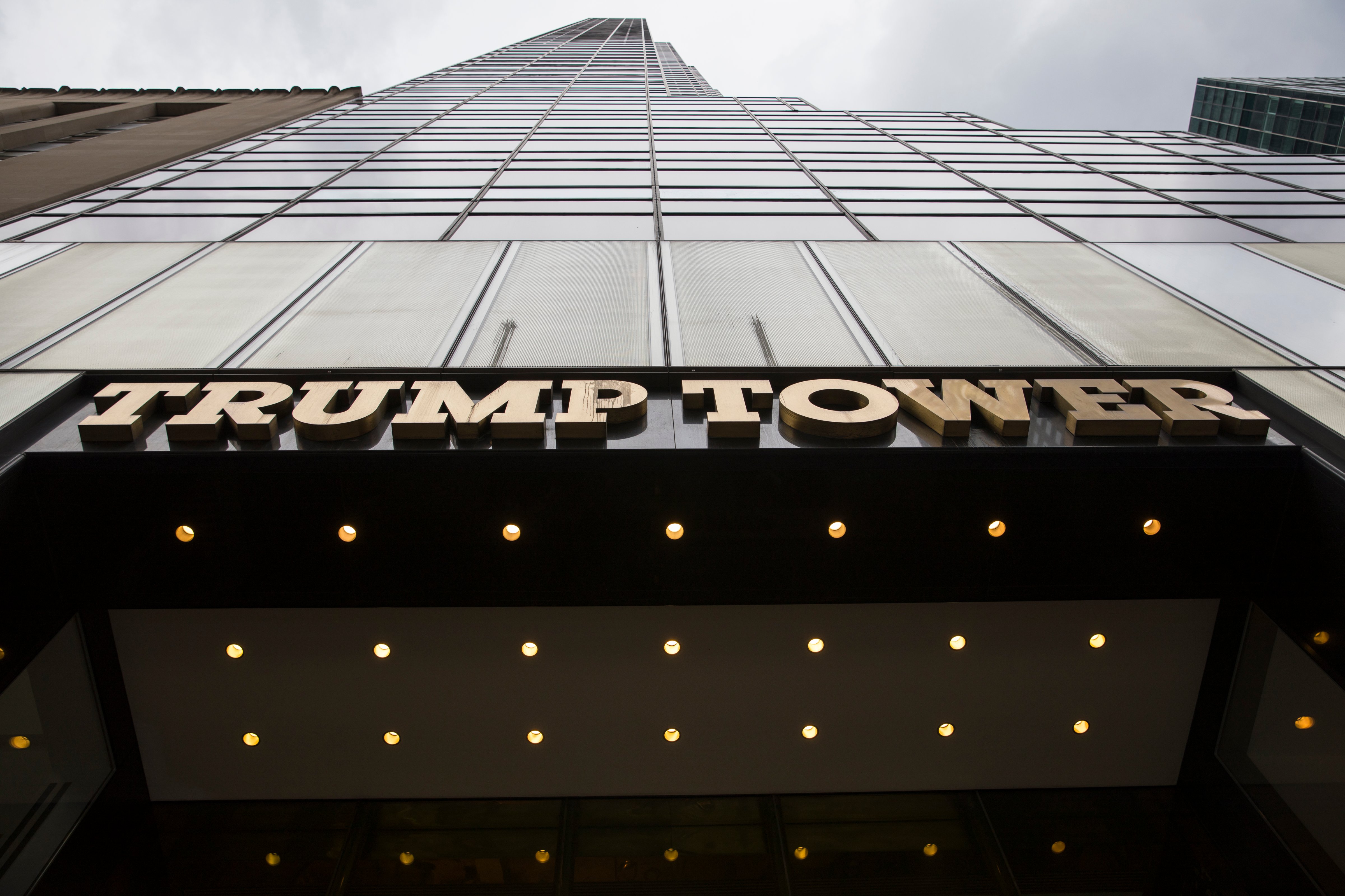 The logo above the entrance to Trump Tower is visible along Fifth Avenue August 14, 2017 in New York City. (Robert Nickelsberg—Getty Images)