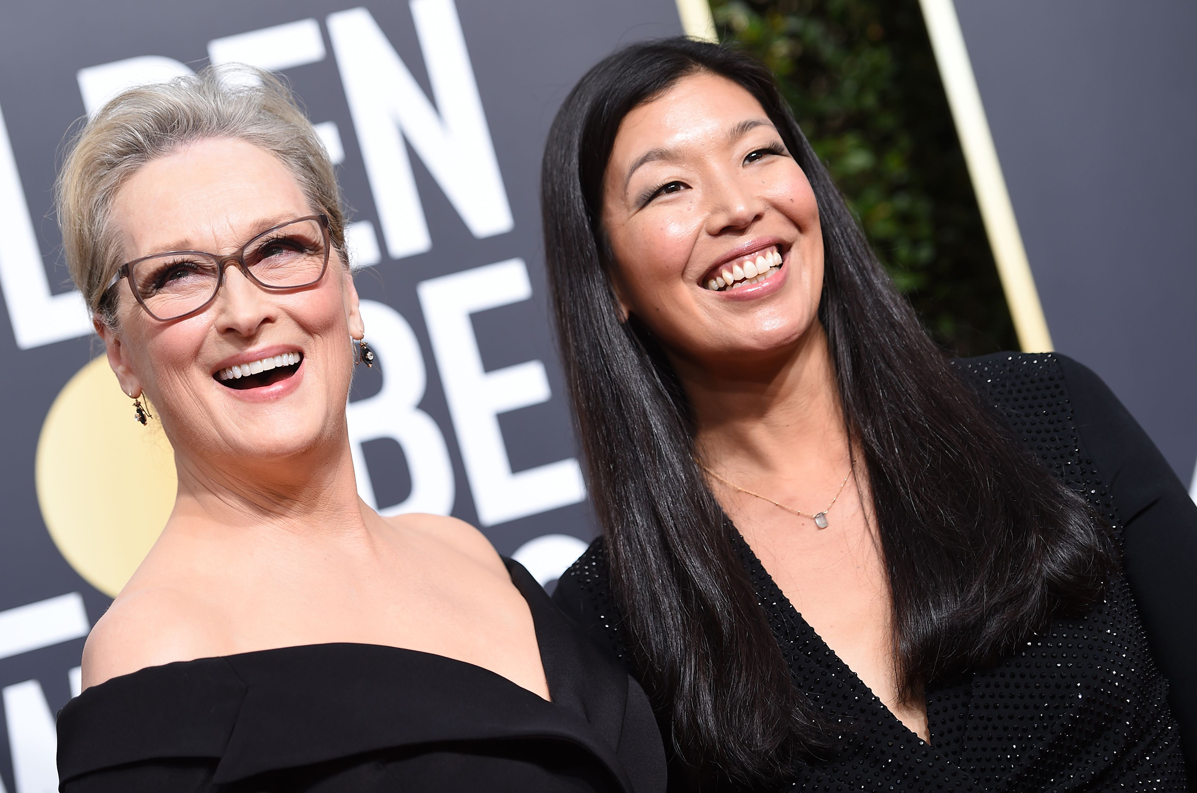 Meryl Streep and Ai-jen Poo, the head of the National Domestic Workers Alliance, arrive for the 75th Golden Globe Awards on January 7, 2018, in Beverly Hills, California. (VALERIE MACON—AFP/Getty Images)