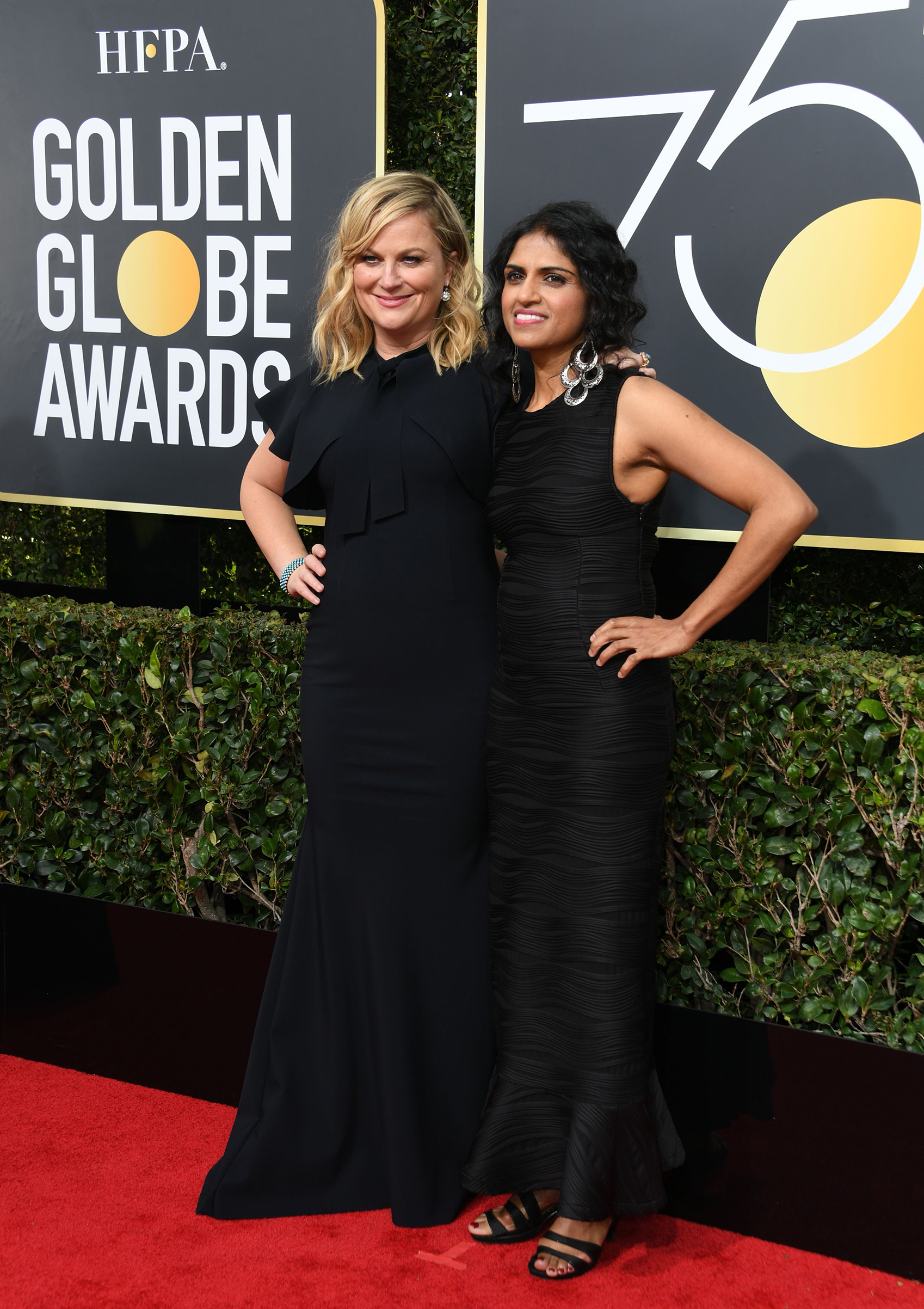 Amy Poehler and Restaurant Opportunities Center United president Saru Jayaraman arrive for the 75th Golden Globe Awards on January 7, 2018, in Beverly Hills, California. (Valerie Macon—AFP/Getty Images)