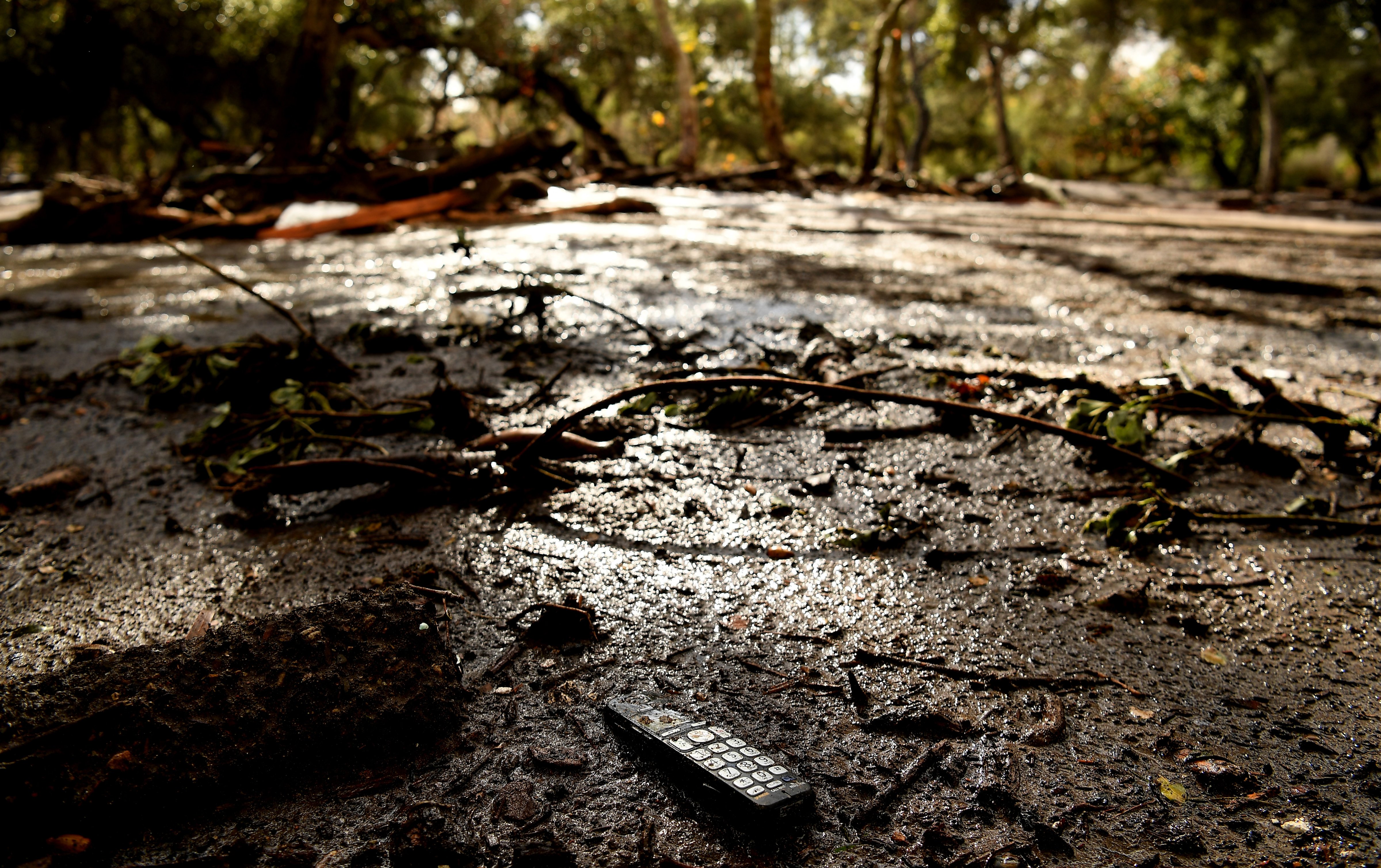 A remote sits in the mud along along Olive Mill Road in Montecito after a major storm hit the burn area January 9, 2018 in Montecito, California. (Wally Skalij—LA Times via Getty Images)