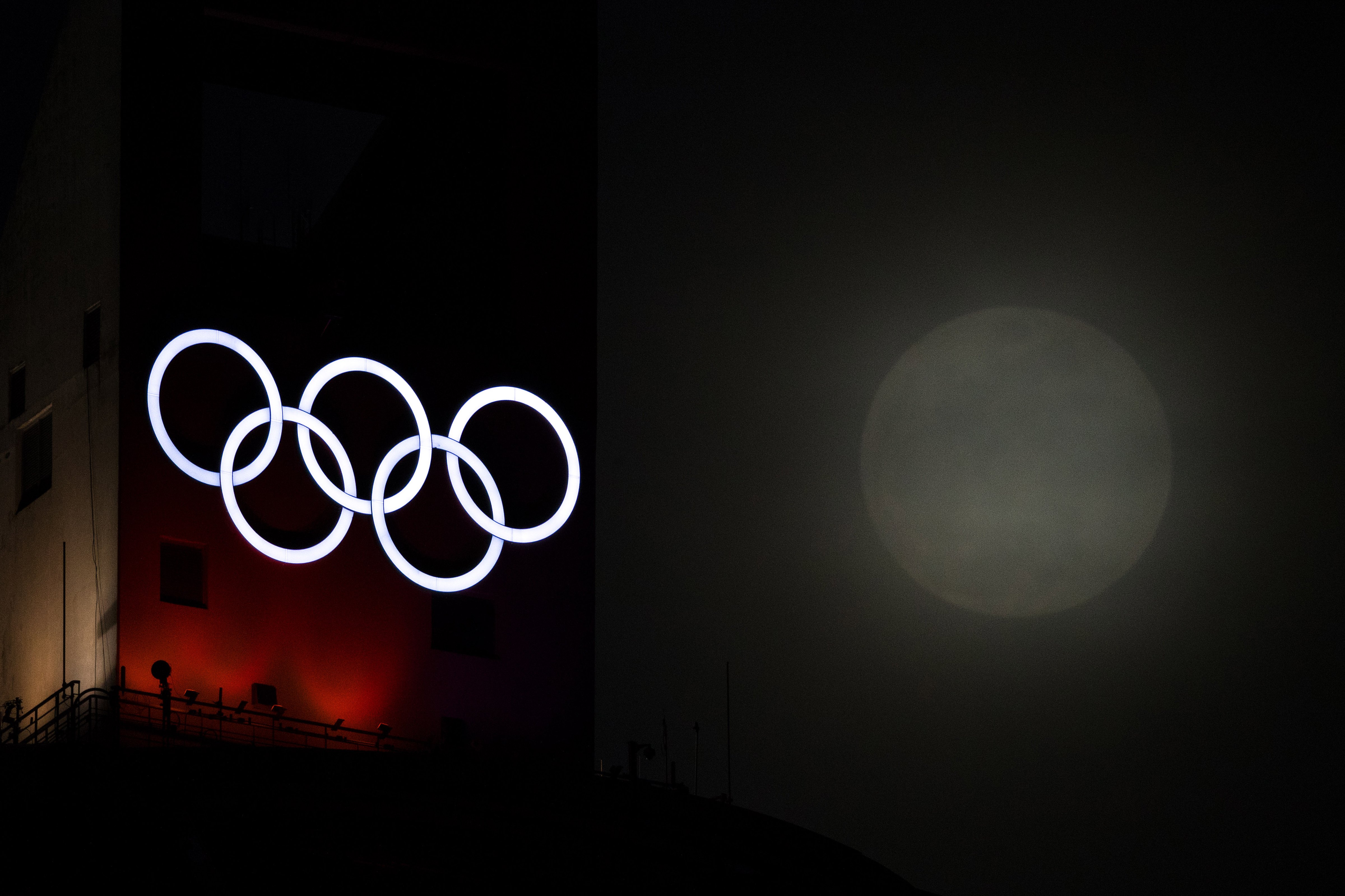 A Super Moon rises through the clouds past the Olympic Rings ahead of the Pyeongchang 2018 Winter Olympics on January 31, 2018 in Pyeongchang-gun, South Korea. (Richard Heathcote—Getty Images)