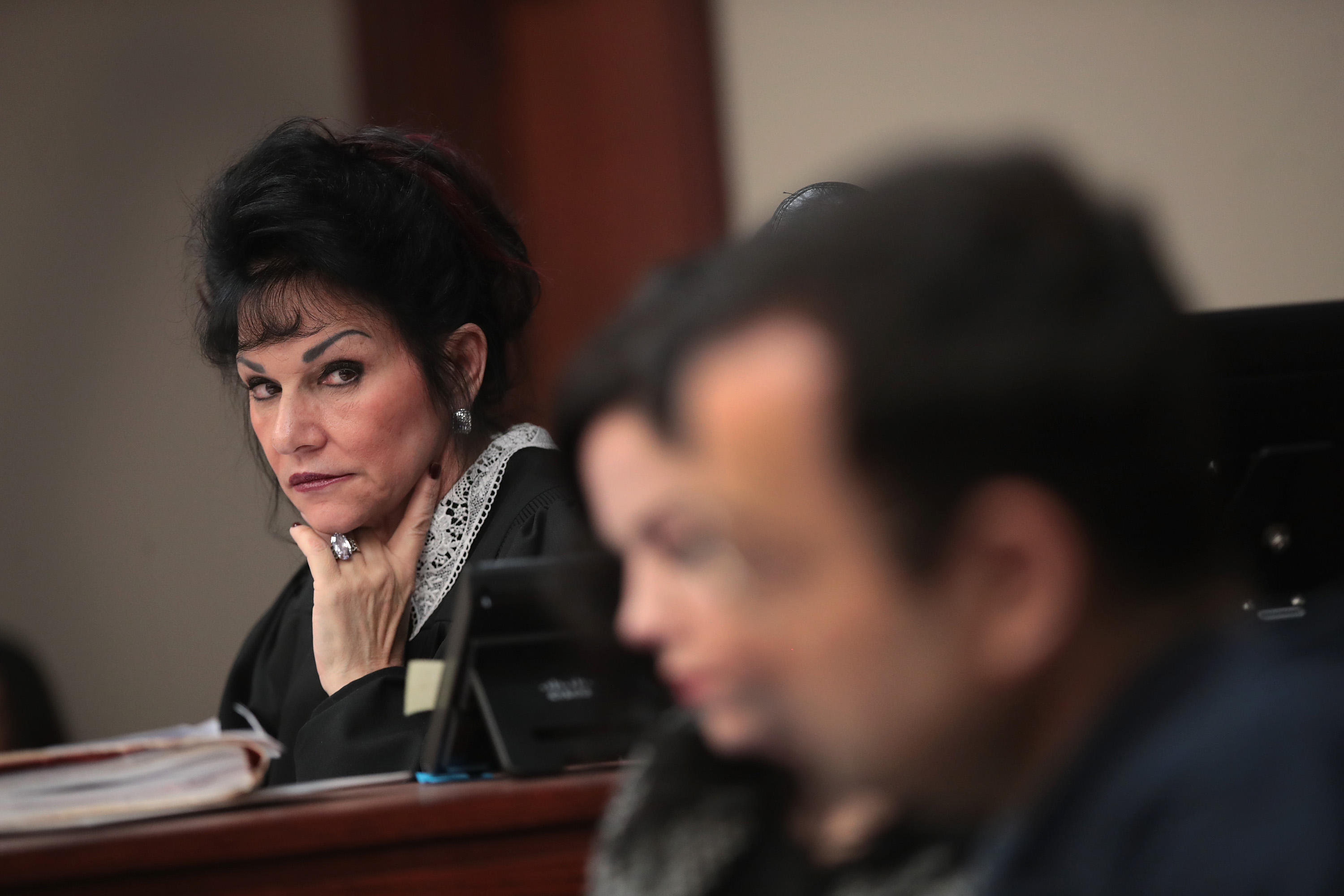 Judge Rosemarie Aquilina (L) looks at Larry Nassar (R) as he listens to a victim's impact statement by Jennifer Rood Bedford prior to being sentenced Wednesday. Photo by Scott Olson/Getty Images (Scott Olson&mdash;Getty Images)