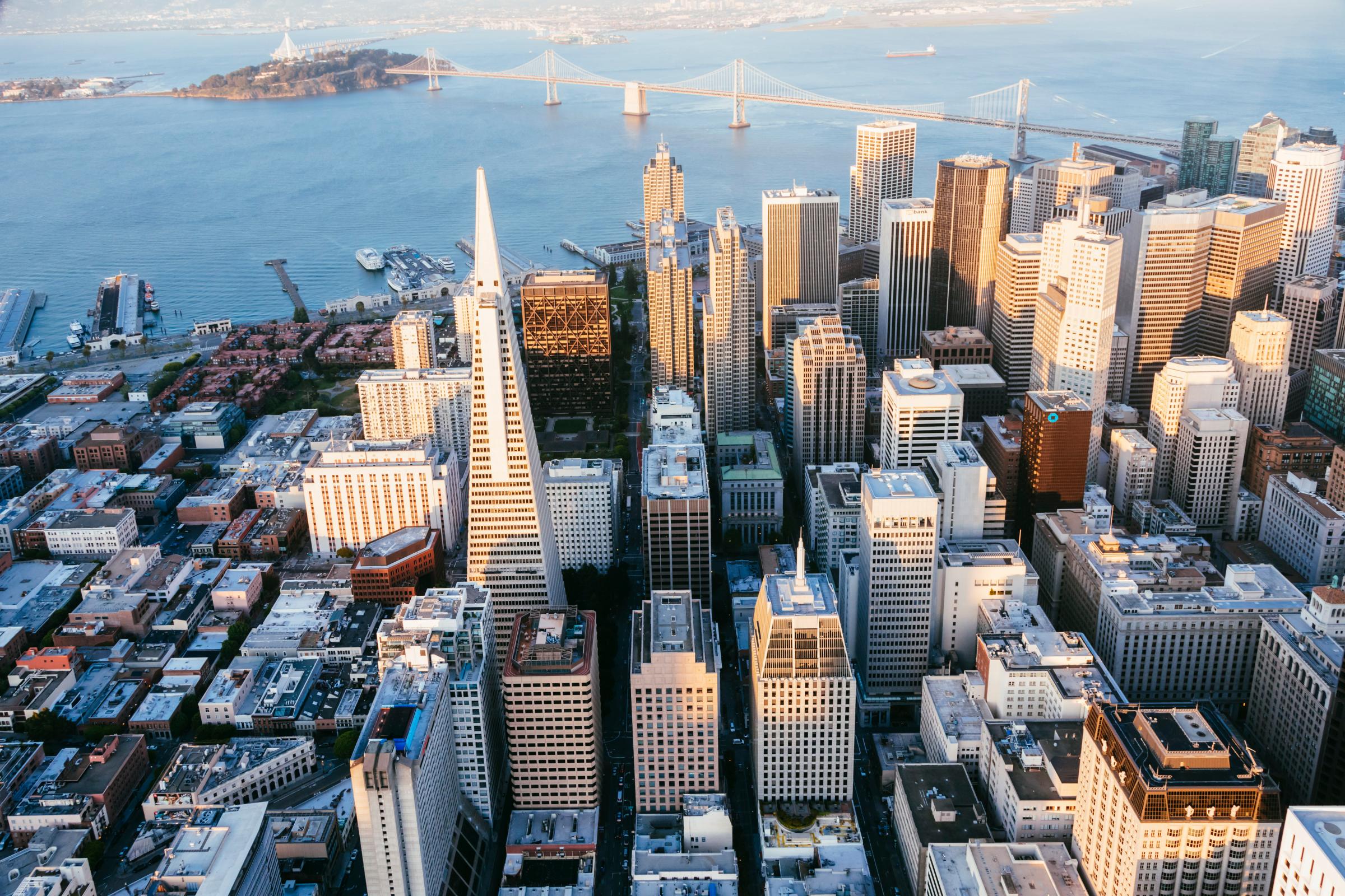 USA, California, San Francisco, Aerial of downtown district with ocean at sunset