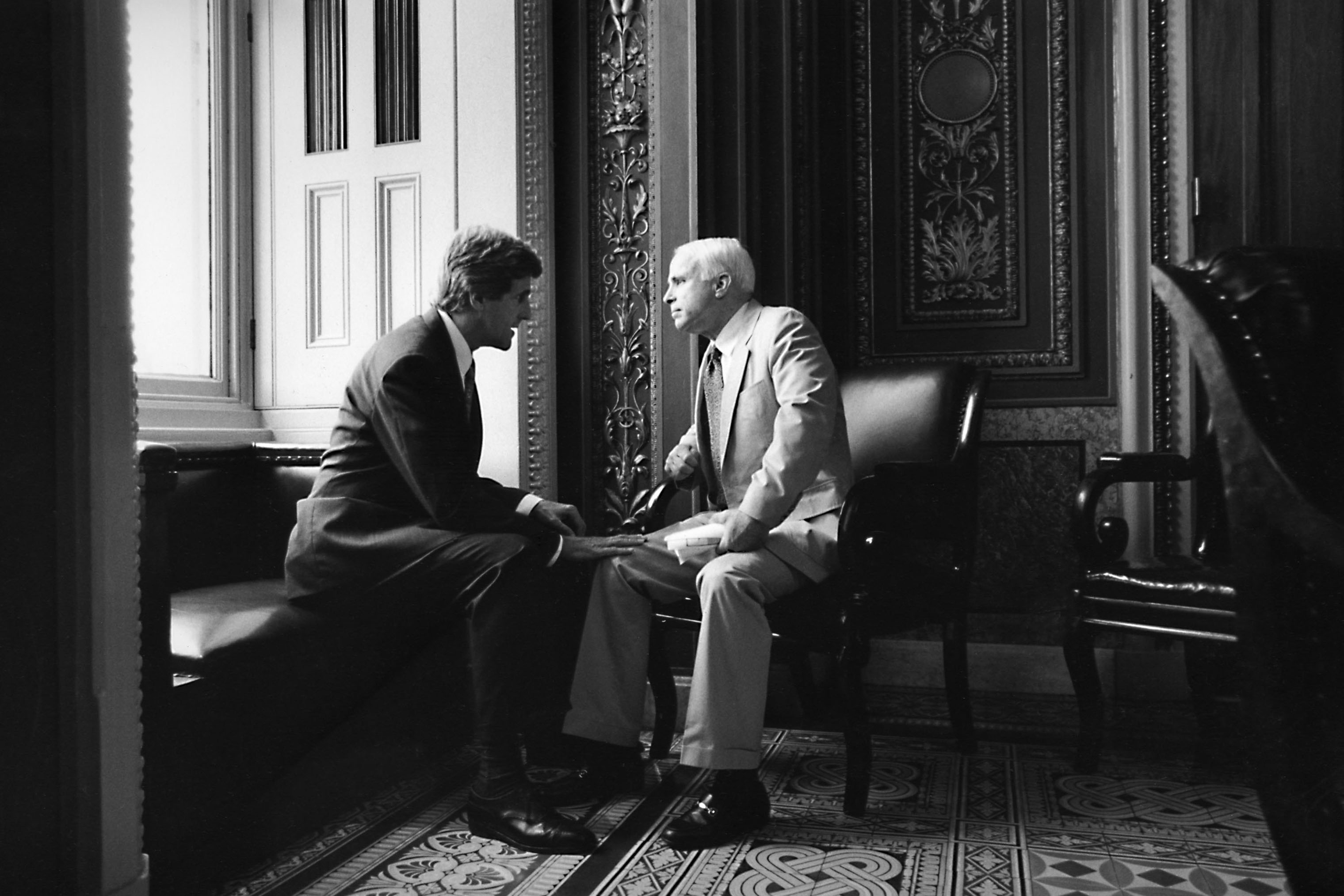 Sen. John Kerry chats with Sen. John McCain in Washington in 1997. (David Hume Kennerly—Getty Images)
