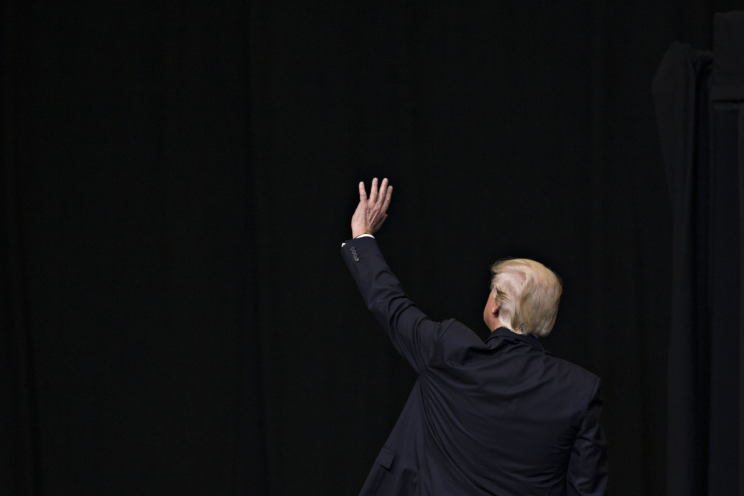 President Donald Trump waves as he leaves after speaking during a rally in Cedar Rapids, Iowa, on June 21, 2017. (Daniel Acker—Bloomberg/Getty Images)