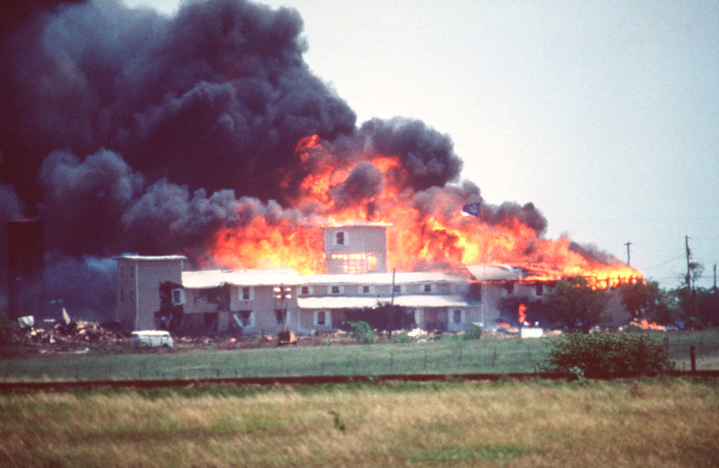 Smoking fire consumes the Branch Davidian Compound during the FBI assault to end the 51-day standoff with cult leader David Koresh and his followers. (Gregory Smith—Corbis via Getty Images)