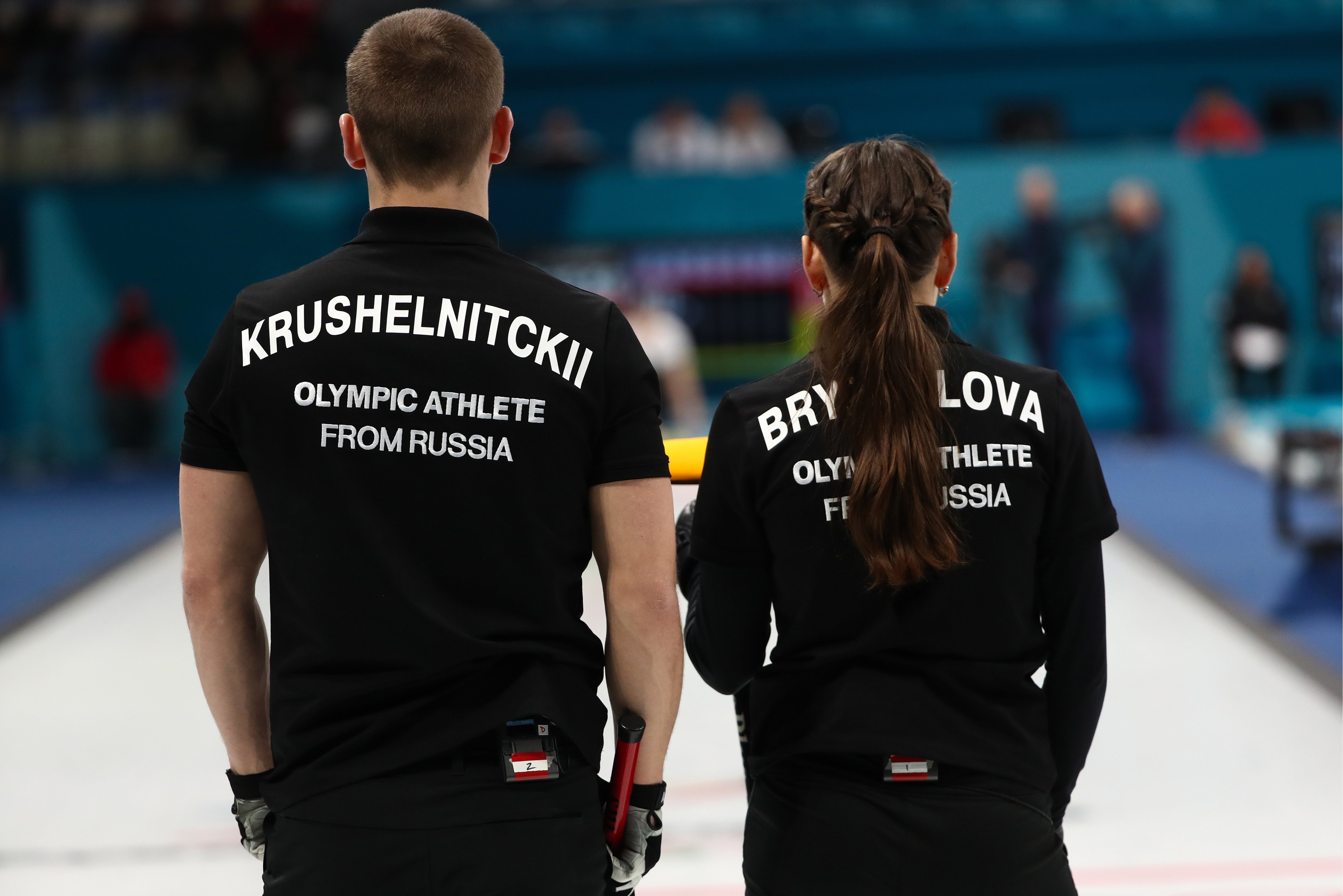 Olympic Athletes from Russia Anastasia Bryzgalova (R) and Alexander Krushelnitsky seen during Session 3 of the Mixed Doubles Round Robin curling competition against Finland at the 2018 Winter Olympic Games at Gangneung Curling Centre. (Valery Sharifulin—Valery Sharifulin/TASS)