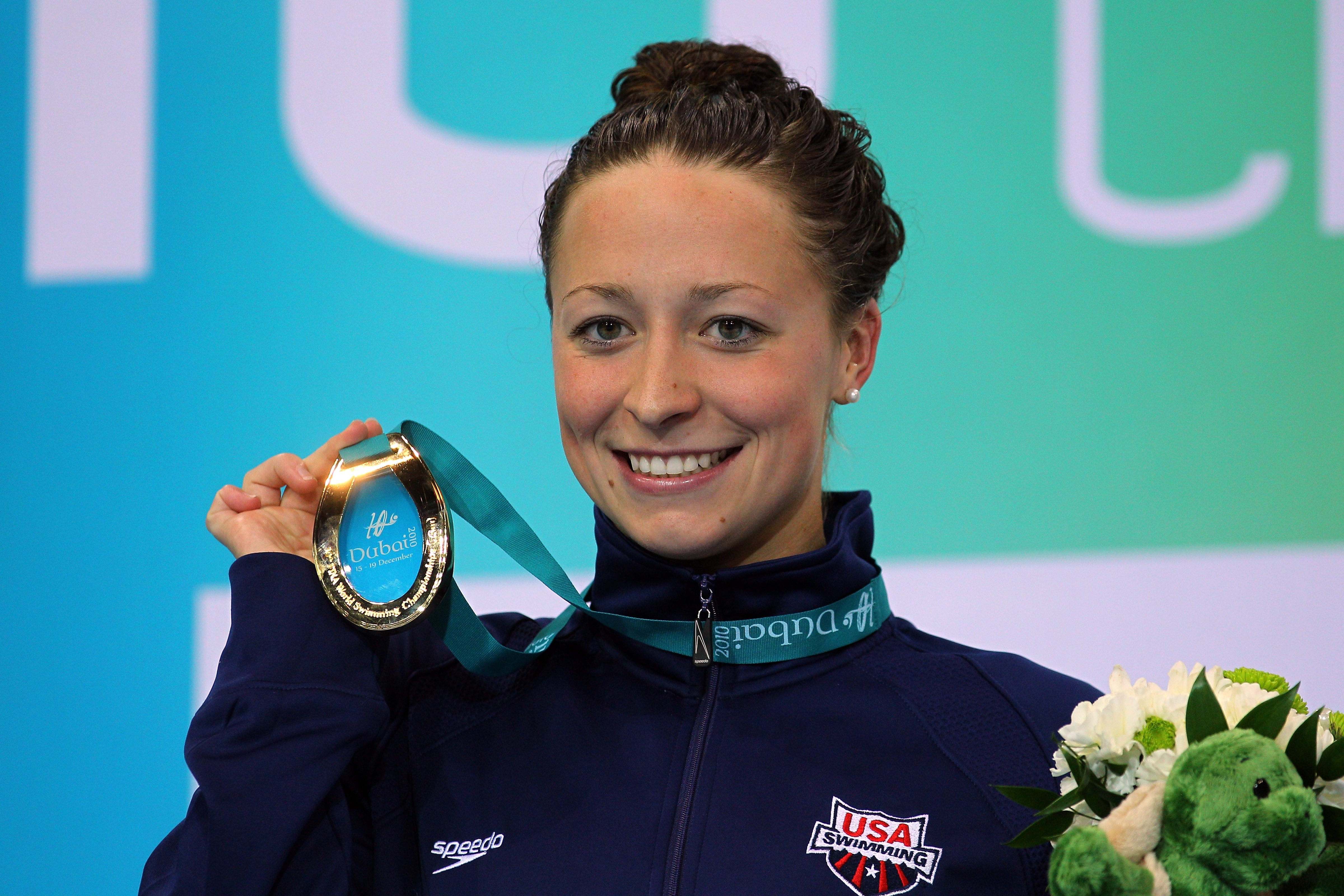 Ariana Kukors poses with her Gold medal after winning the Women's 100m Individual Medley final at the FINA World Swimming Championships. (Clive Rose&mdash;Getty Images)