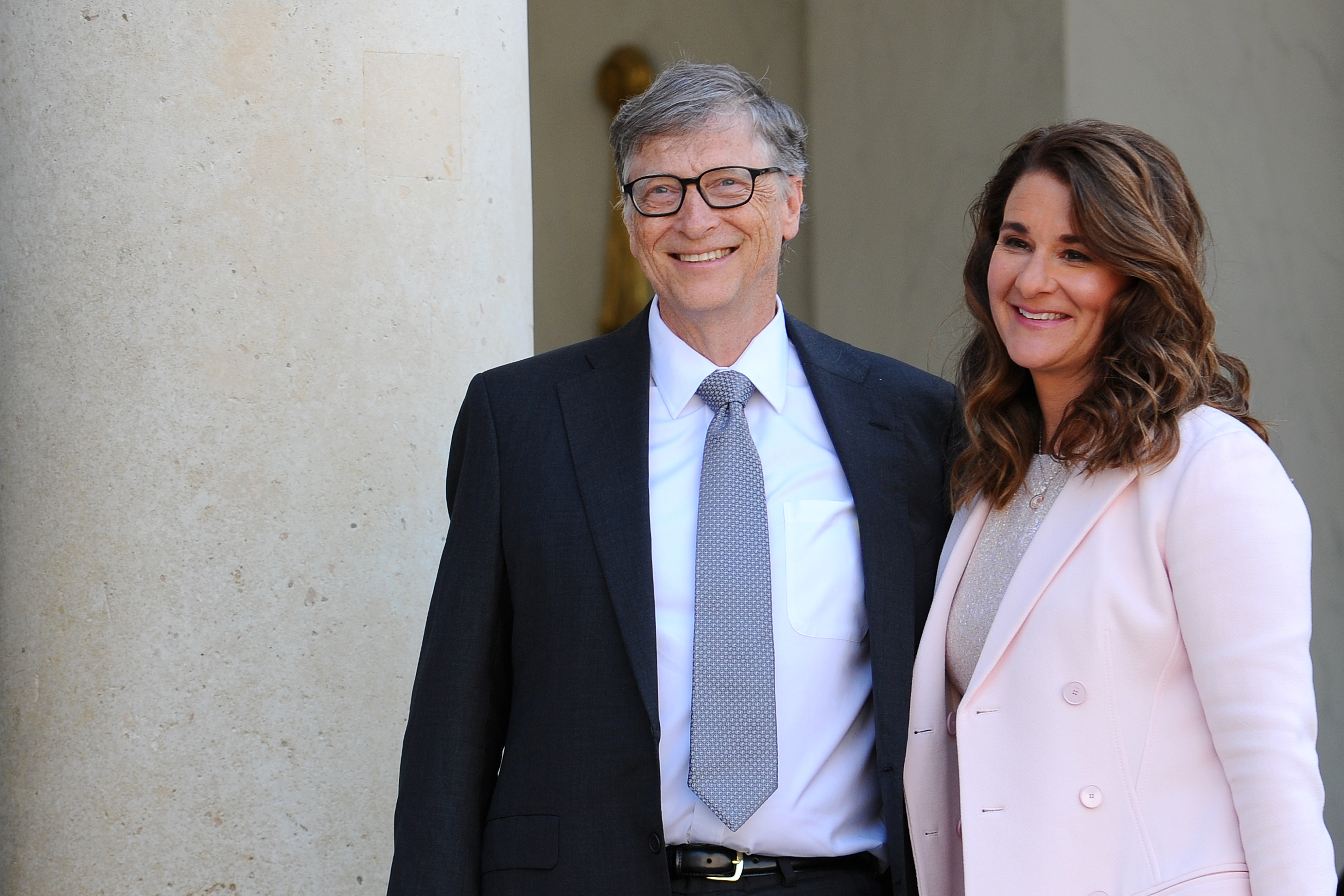 Bill and Melinda Gates pose in front of the Elysee Palace before receiving the award of Commander of the Legion of Honor. (Frederic Stevens&mdash;Getty Images)