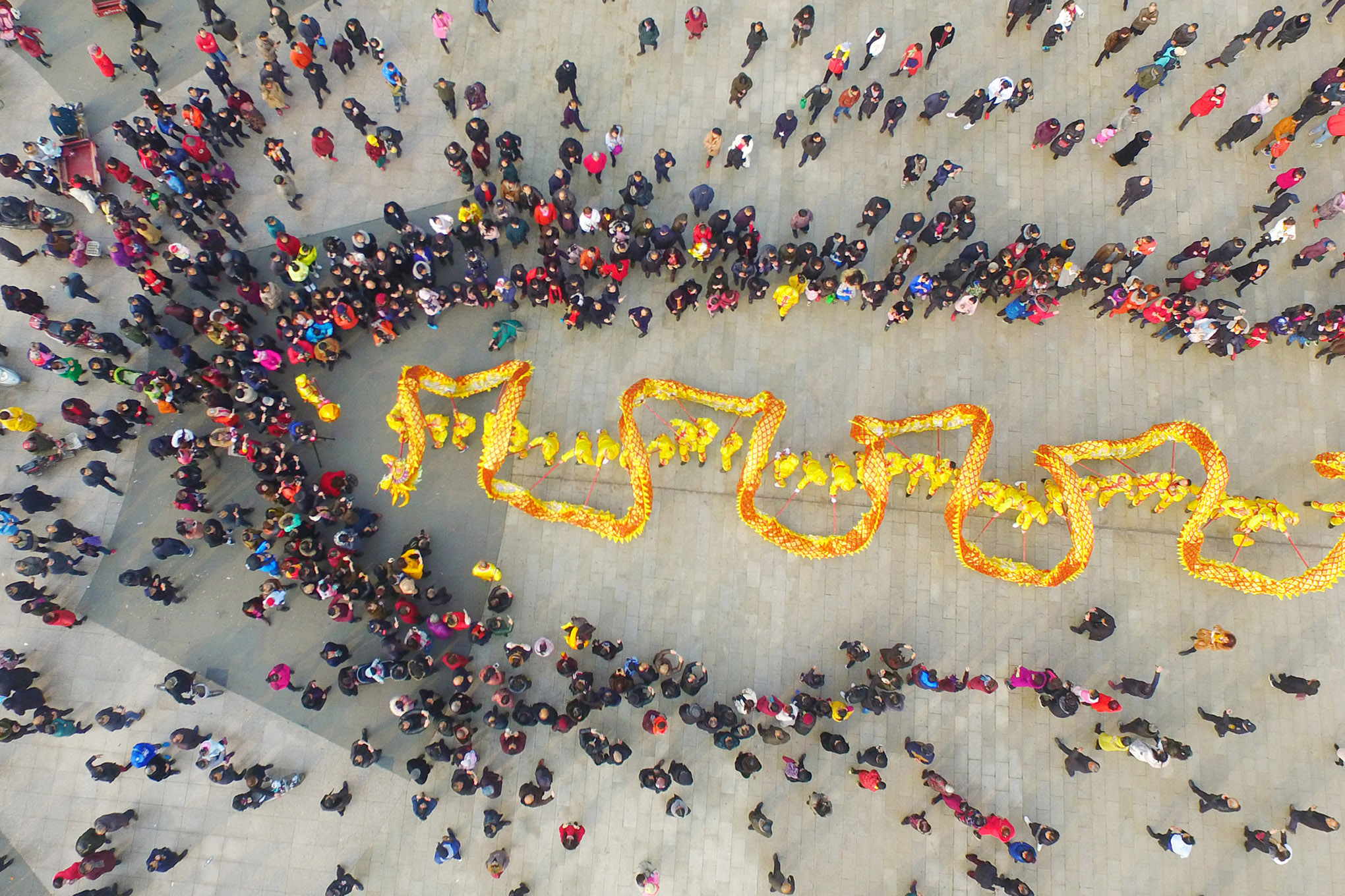 Aerial view of a large crowd watching dragon dance to welcome Lunar New Year on Feb. 16, 2018 in Chengdu, Sichuan Province of China.