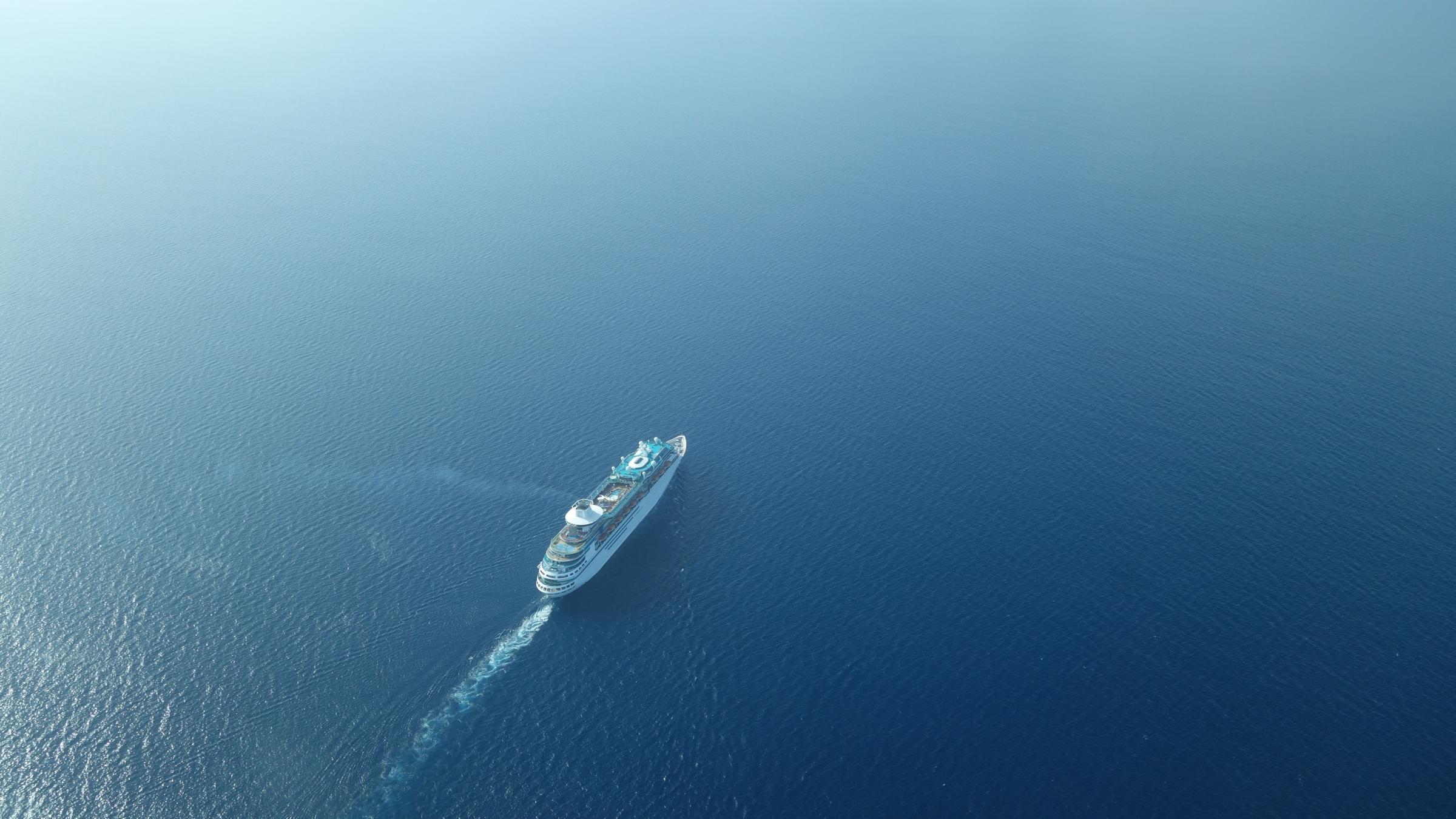 Aerial View Of Cruise Ship Sailing On Sea