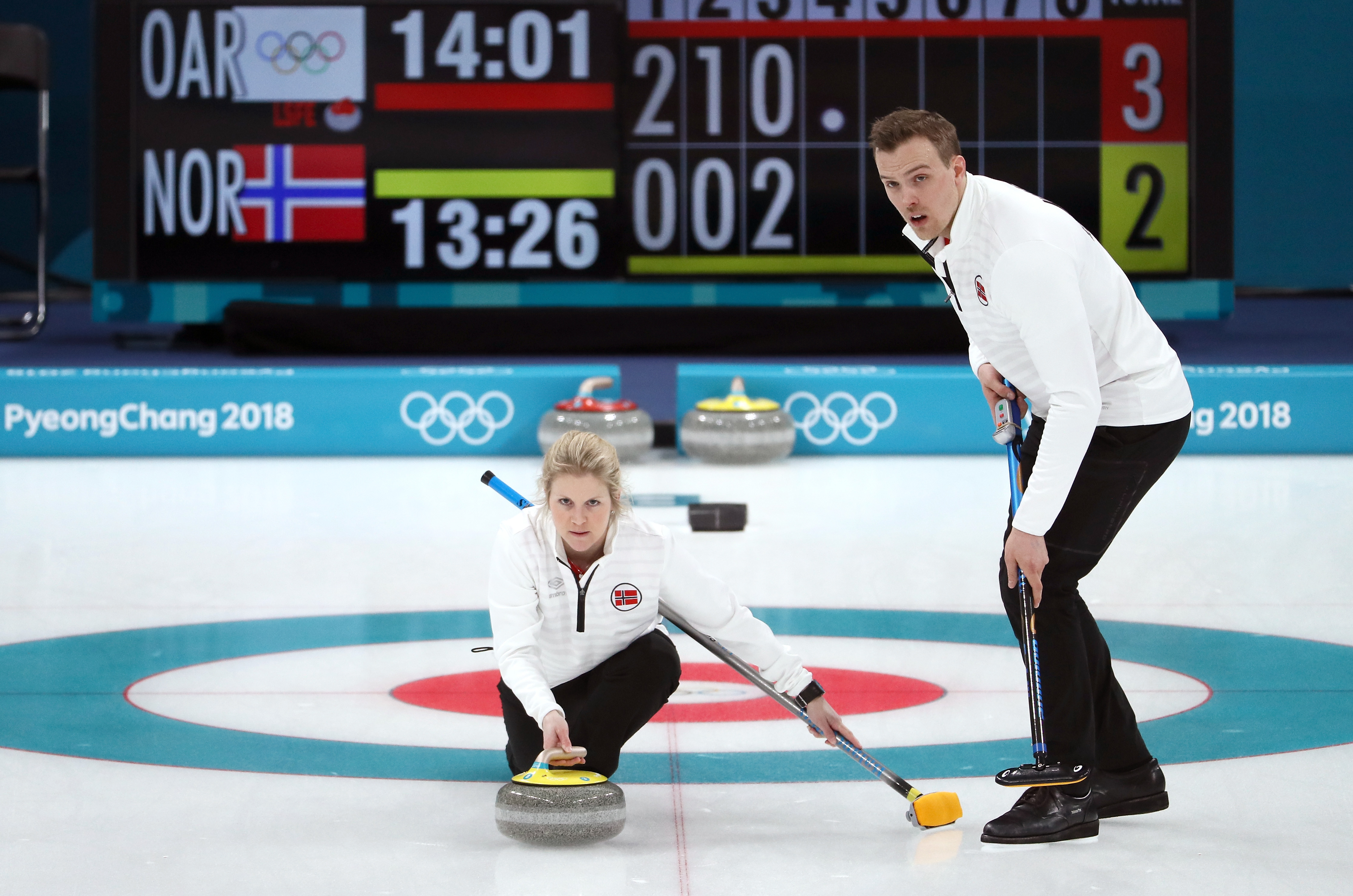 Kristin Skaslien and Magnus Nedregotten of Norway deliver a stone against Olympic Athletes from Russia during the Curling Mixed Doubles Bronze Medal Game on day four of the PyeongChang 2018 Winter Olympic Games at Gangneung Curling Centre on February 13, 2018 in Gangneung, South Korea. (Jamie Squire—Getty Images)