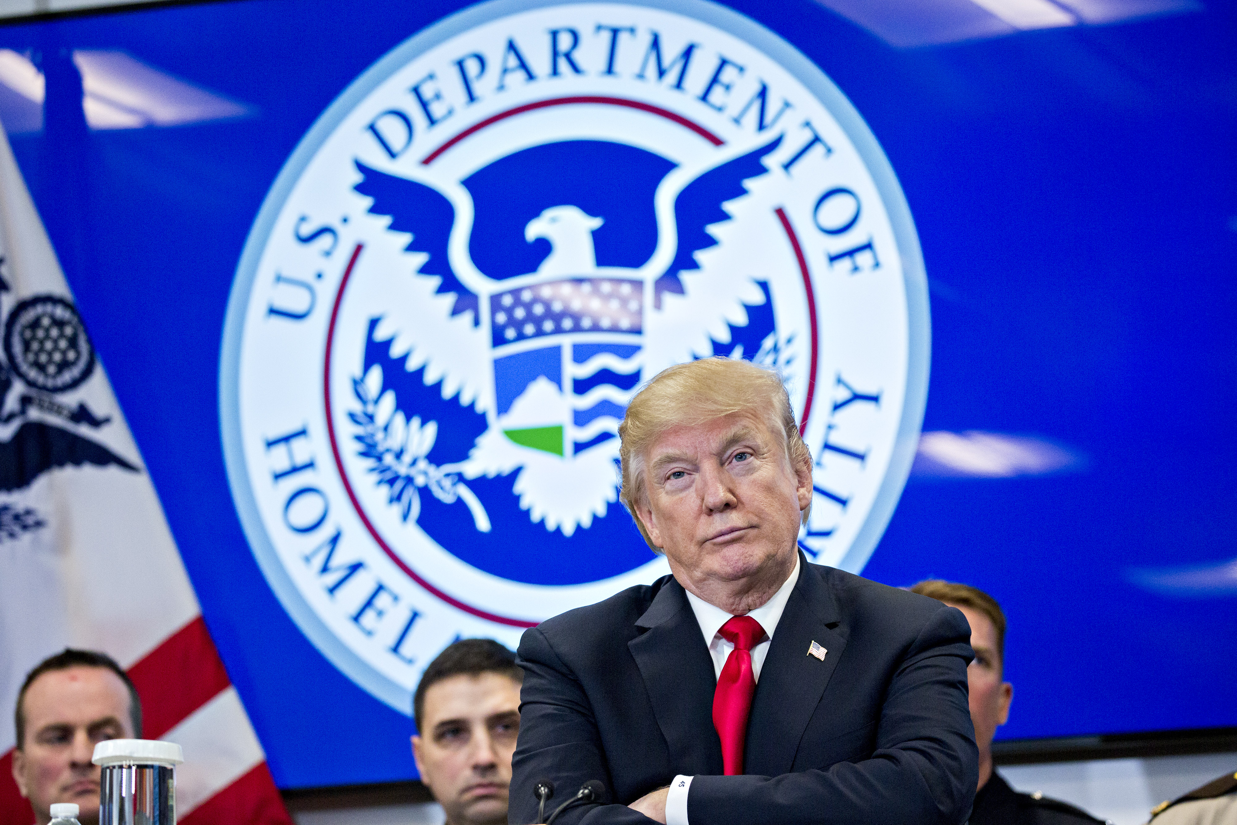 U.S. President Donald Trump listens while participating in a Customs and Border Protection (CBP) roundtable discussion after touring the CBP National Targeting Center February 2, 2018 in Sterling, Virginia. Trump is looking to ratchet up pressure on lawmakers to consider the immigration proposal he unveiled in Tuesday's State of the Union using the visit as an opportunity to again argue his proposal would bolster the country's borders. (Photo by Andrew Harrer-Pool—Getty Images)