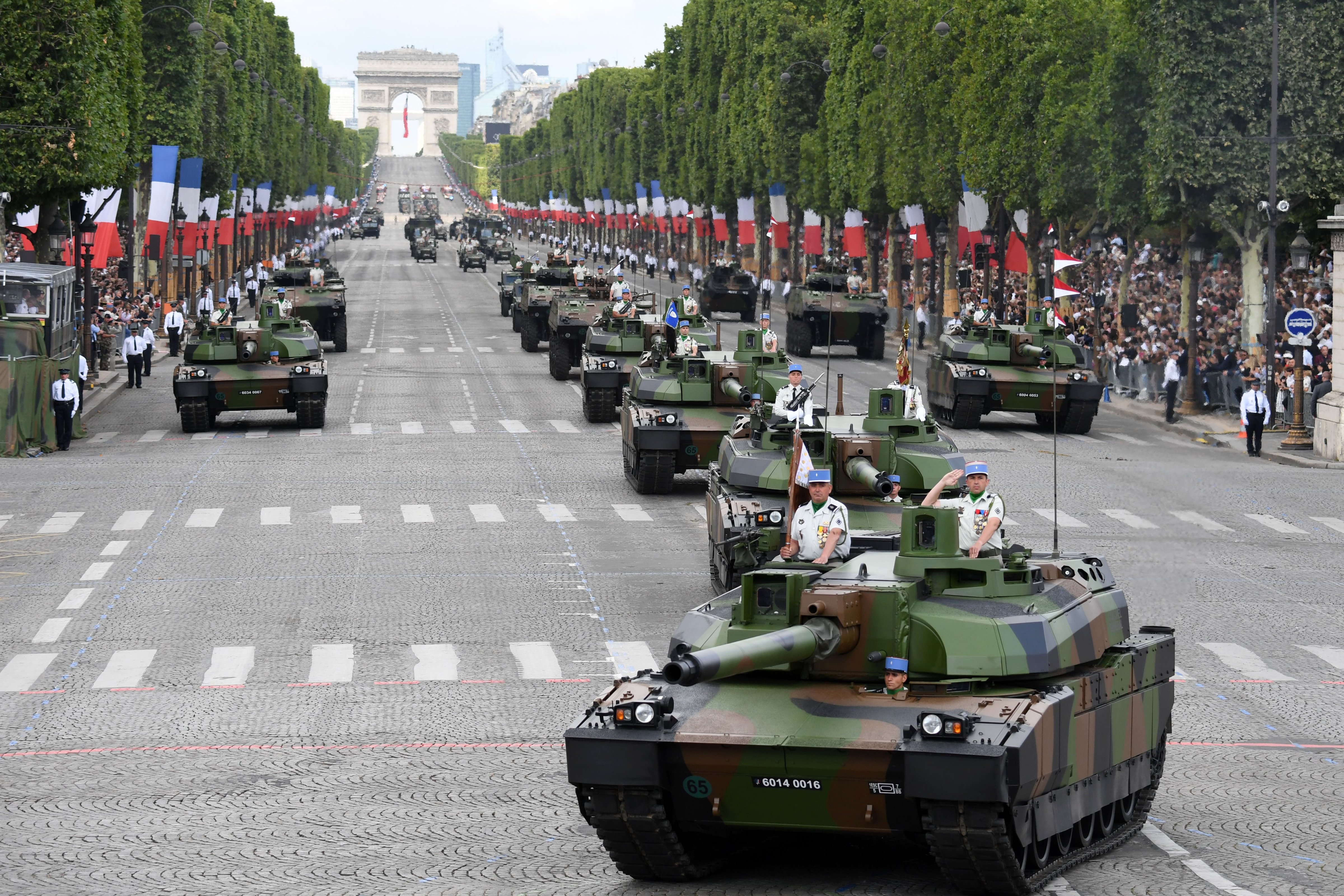Members of the 5e Regiment de Dragons (5th Dragoon Regiment) parade on Leclerc tanks during the annual Bastille Day military parade on the Champs-Elysees avenue in Paris on July 14, 2017. (ALAIN JOCARD—AFP/Getty Images)