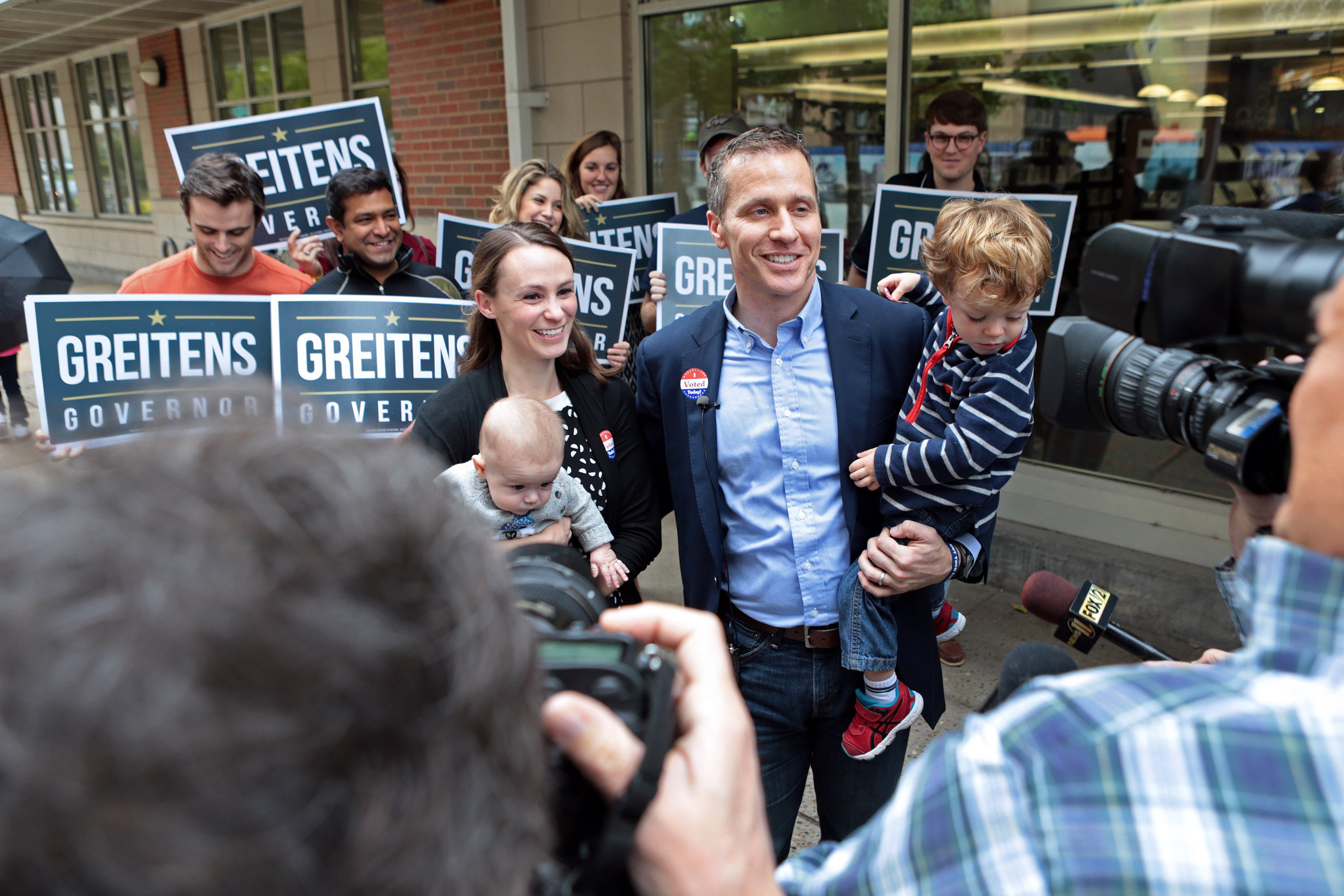 Republican gubernatorial candidate Eric Greitens and wife Sheena hold their children, Jacob (left) and Joshua, while addressing the media after casting their vote on Tuesday, Nov. 8, 2016 at the St. Louis Public Library Schlafly branch in St. Louis, Mo. (St. Louis Post-Dispatch&mdash;TNS via Getty Images)