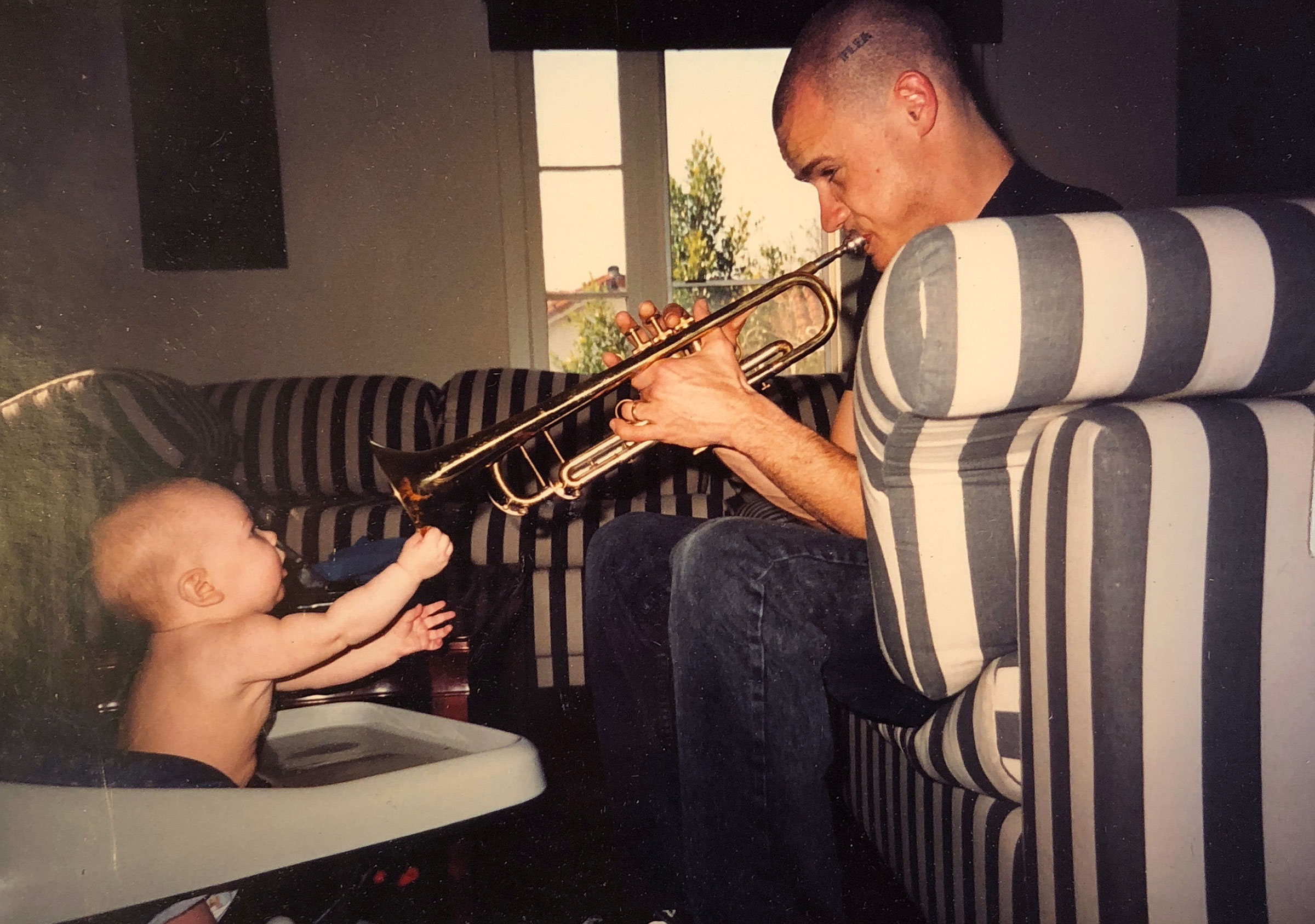 Flea at age 26 with his one year old daughter, Clara Balzary. (Courtesy of Flea)