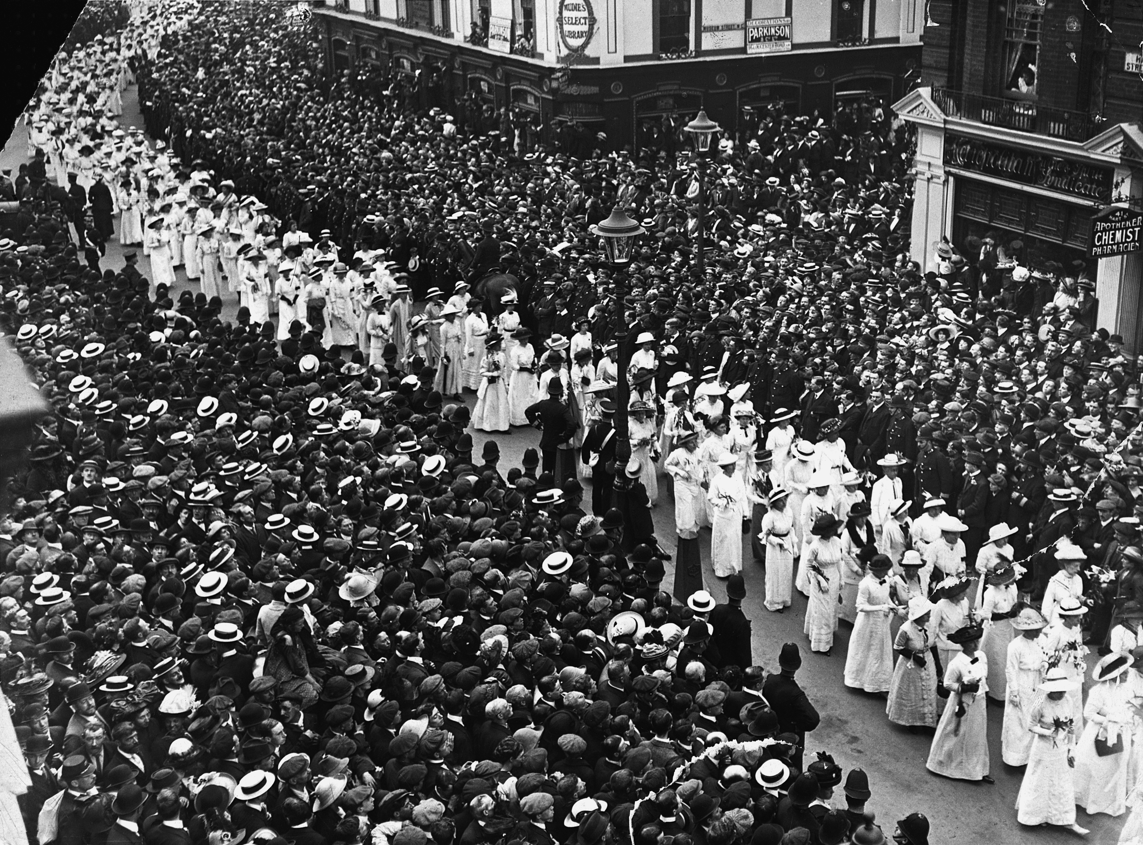 Suffragettes dressed in white follow the mourning procession at the funeral of Emily Davidson, the suffragette who was killed when she threw herself in front of King George V's horse at the Epsom Derby as an act of protest. (Photo by © Hulton-Deutsch Collection/CORBIS/Corbis via Getty Images) (Hulton Deutsch—Corbis via Getty Images)