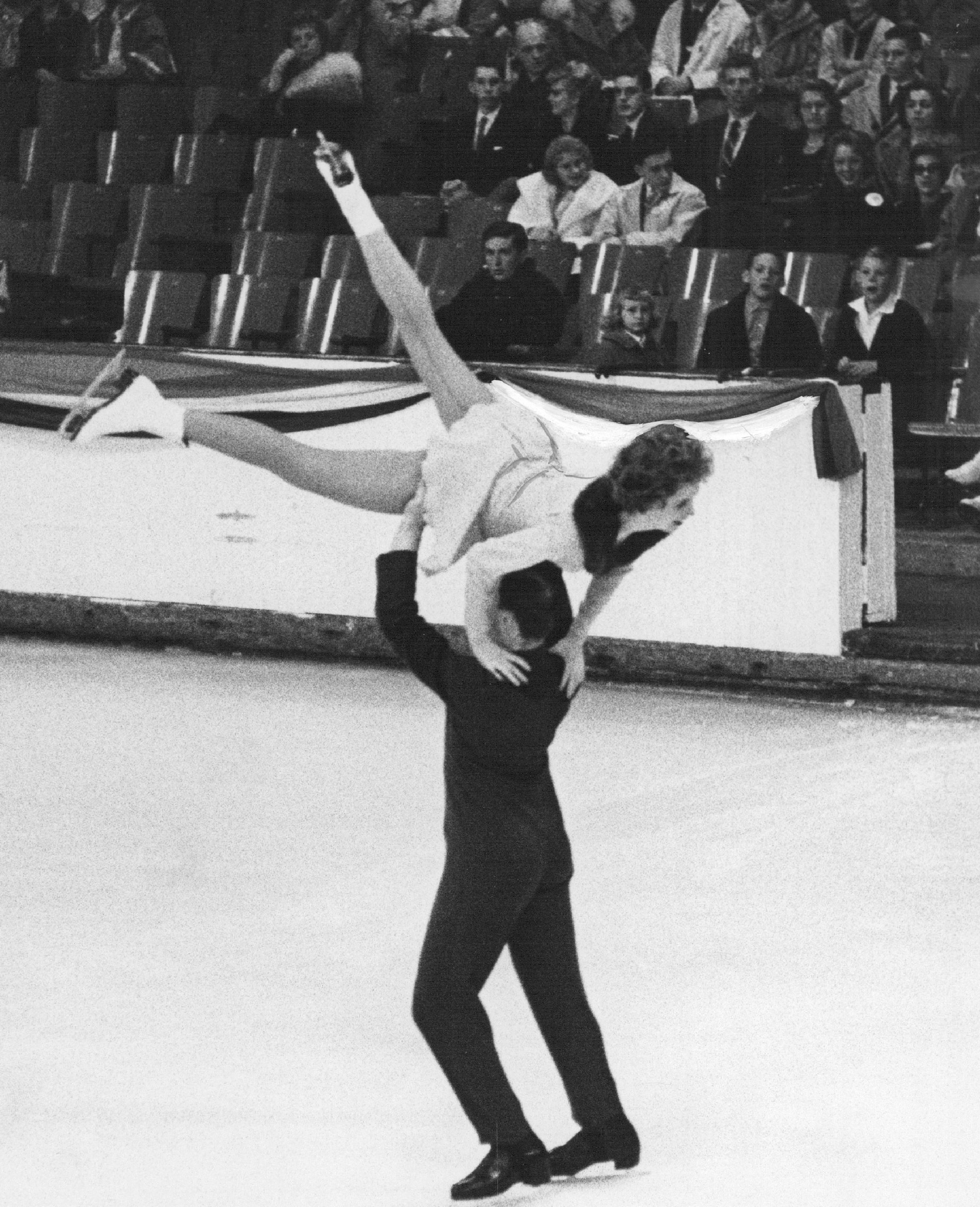 Dudley Richards lifts Maribel Y. Owen in a winning effort in the Senior Pairs competition at the National Figure Skating Championships in Colorado Springs, on Jan. 28, 1961. (Denver Post/Getty Images)