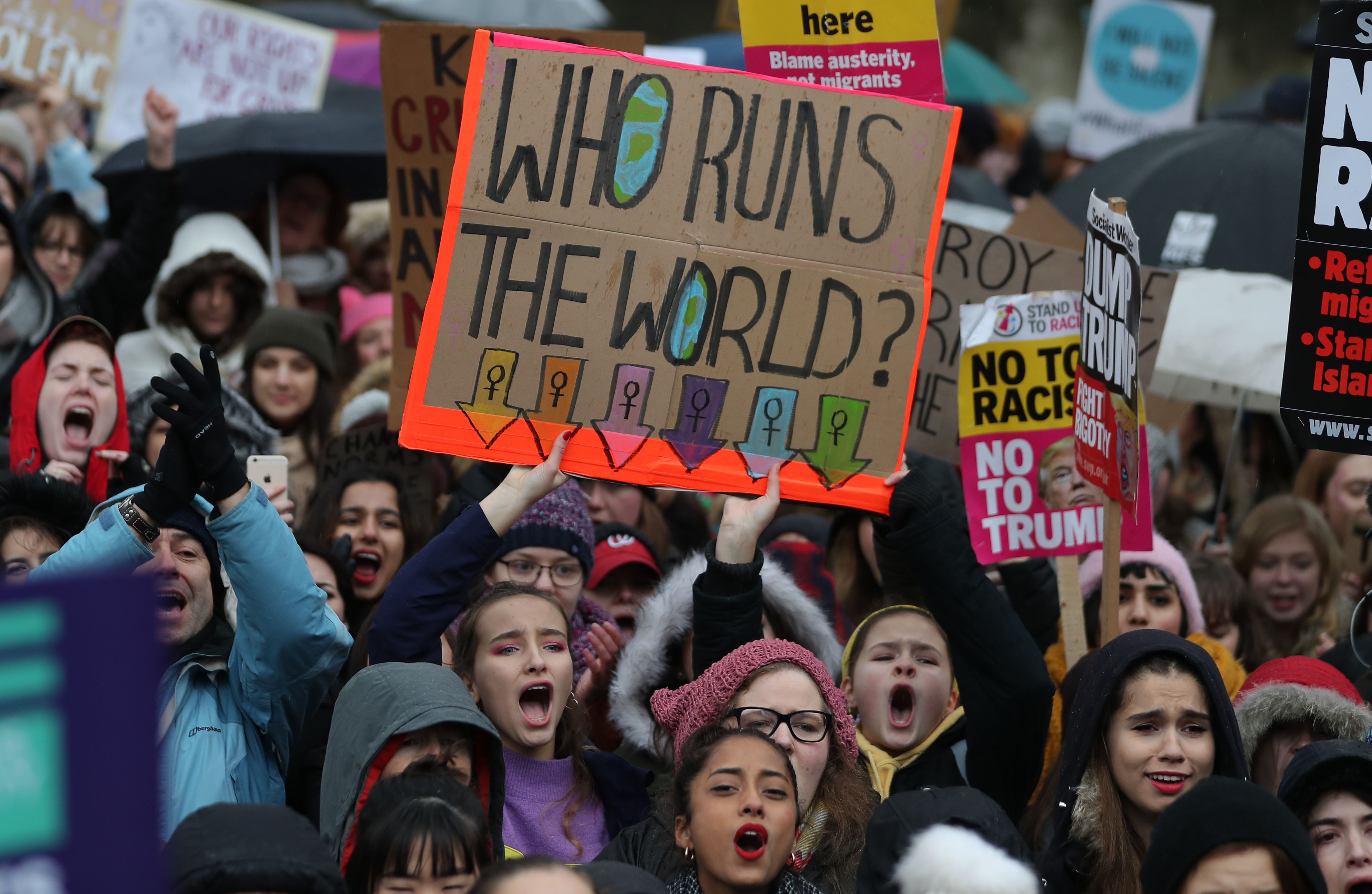 Protesters hold up placards during the Women's March in London on Jan. 21, 2018 as part of a global day of protests, a year to the day since Donald Trump took office as U.S. president. (Daniel Leal-Olivas—AFP/Getty Images)