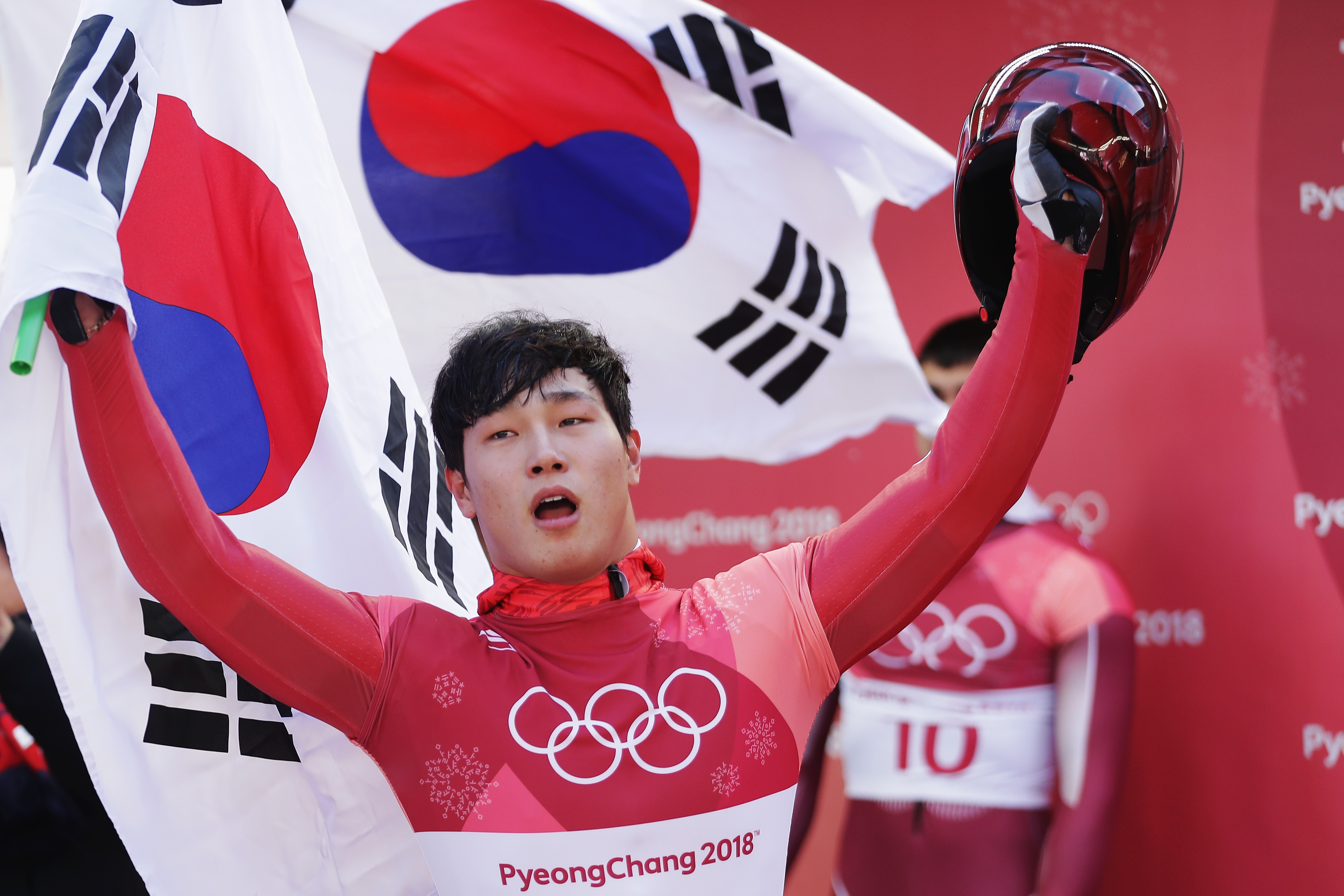Sungbin Yun of Korea celebrates winning the Men's Skeleton in Pyeongchang, South Koreaon Feb. 16, 2018. (Richard Heathcote—Getty Images)