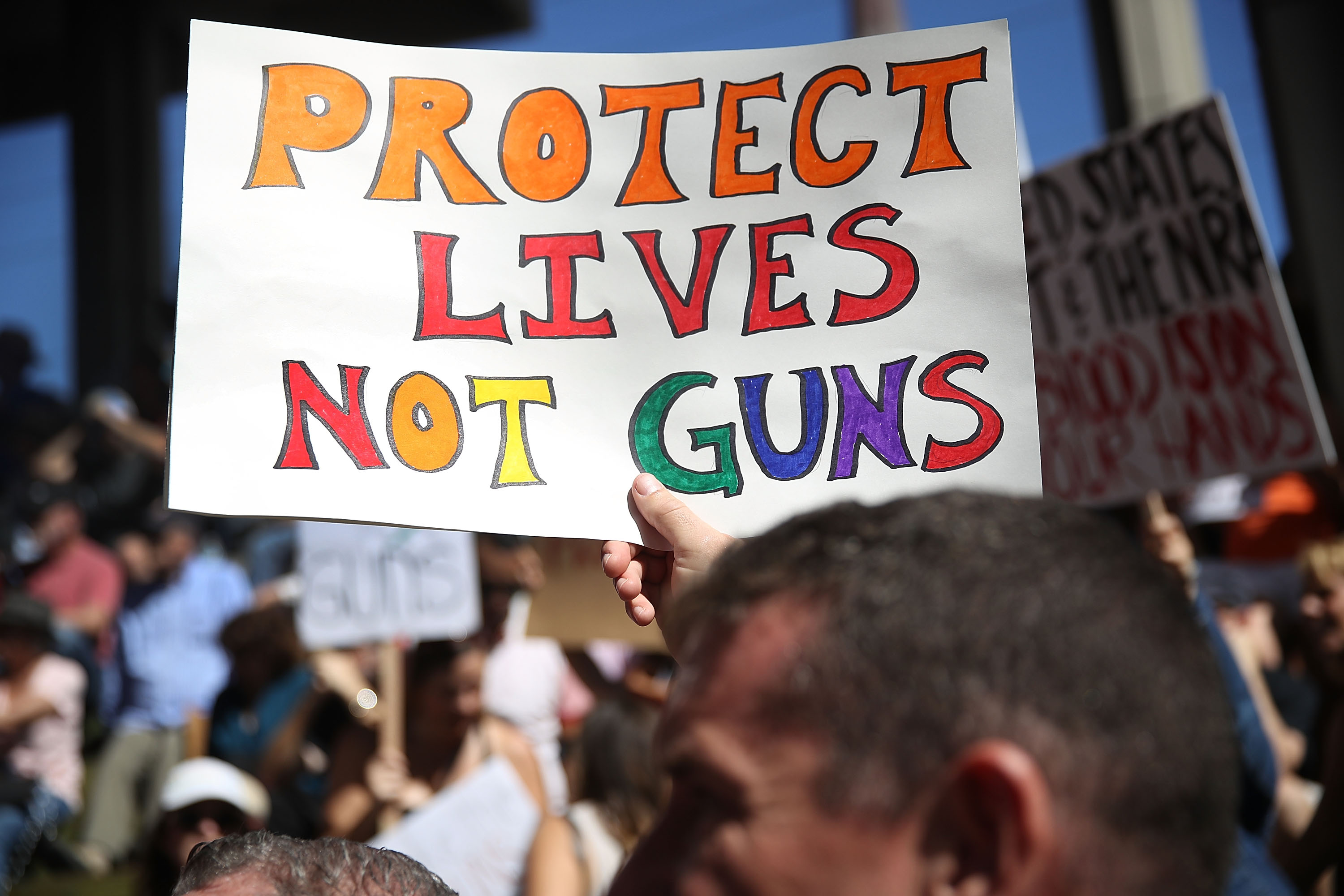 People join together after a school shooting that killed 17 to protest against guns on the steps of the Broward County Federal courthouse on February 17, 2018 in Fort Lauderdale, Florida. Earlier this week former student Nikolas Cruz opened fire with a AR-15 rifle at the Marjory Stoneman Douglas High School killing 17 people.  (Photo by Joe Raedle/Getty Images) (Joe Raedle—Getty Images)