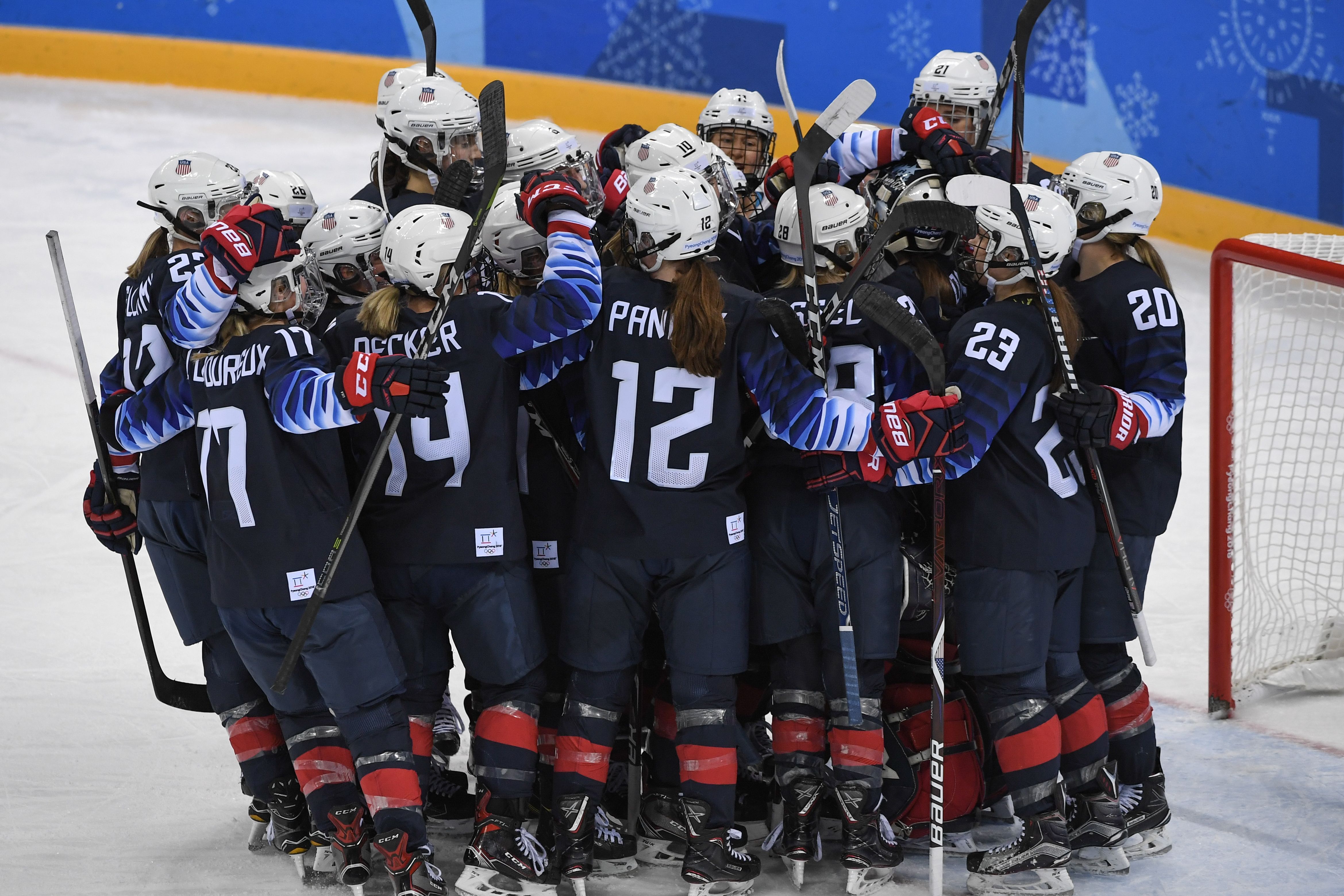 U.S. players celebrate after the women's ice hockey semifinal game between the United States and Finland during the Pyeongchang 2018 Winter Olympic Games at the Gangneung Hockey Centre in Gangneung on Feb. 19, 2018. (Jung Yeon-Je—AFP/Getty Images)