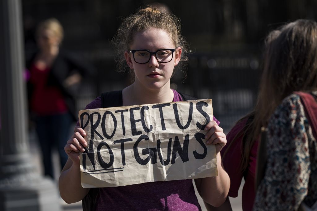 WASHINGTON, USA - February 21: A student holds a placard as hundreds of students call for greater gun control laws as they protest outside of the White House in Washington, USA on February 21, 2018. Protests led mostly by young students were sparked around the country calling for greater gun control after the mass shooting at a high school in Parkland, Fla. where 17 people were killed. (Photo by Samuel Corum/Anadolu Agency/Getty Images) (Anadolu Agency&mdash;Getty Images)