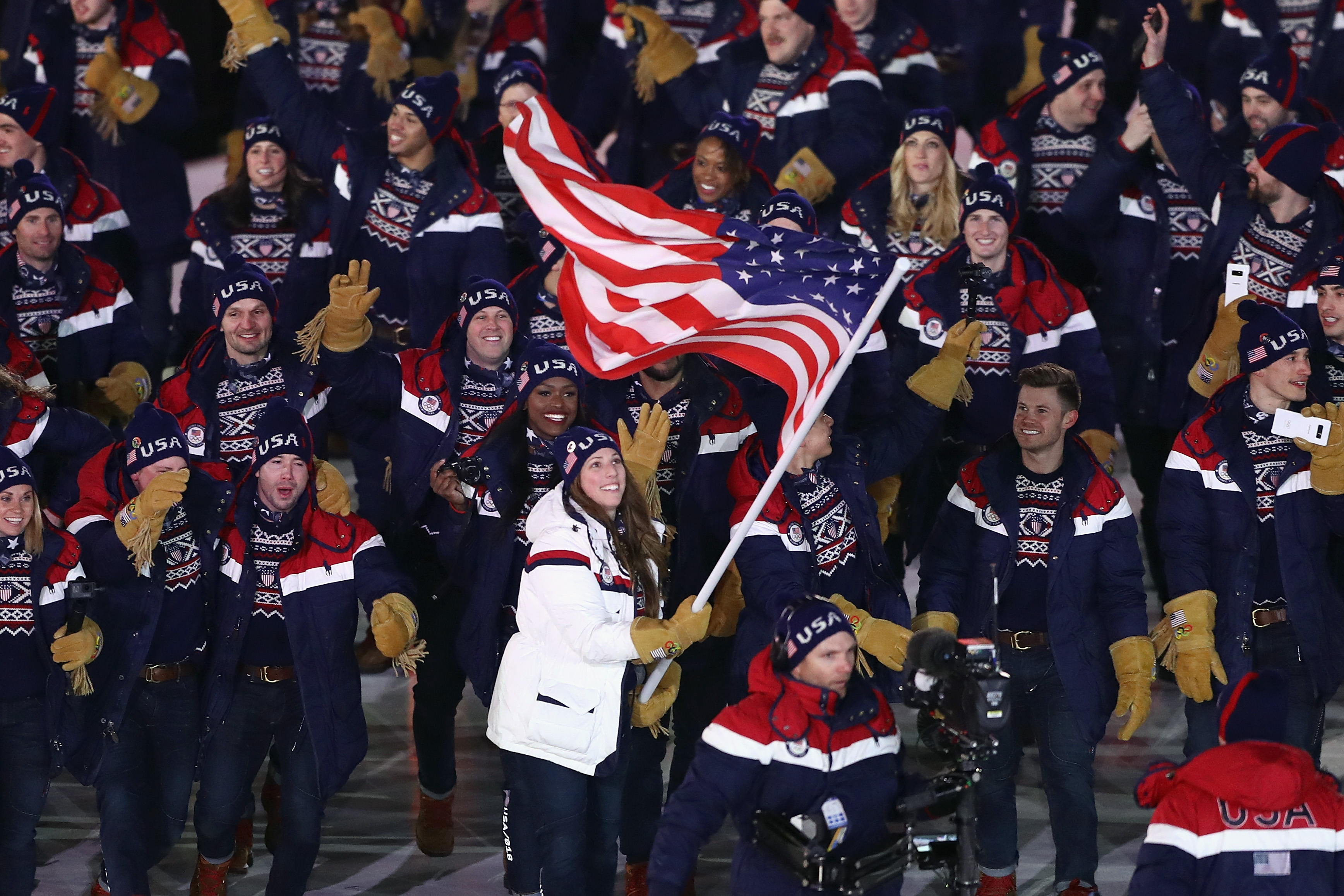 Flag bearer Erin Hamlin leads Team USA at the Opening Ceremony of the PyeongChang 2018 Winter Olympic Games. (Ryan Pierse—Getty Images)