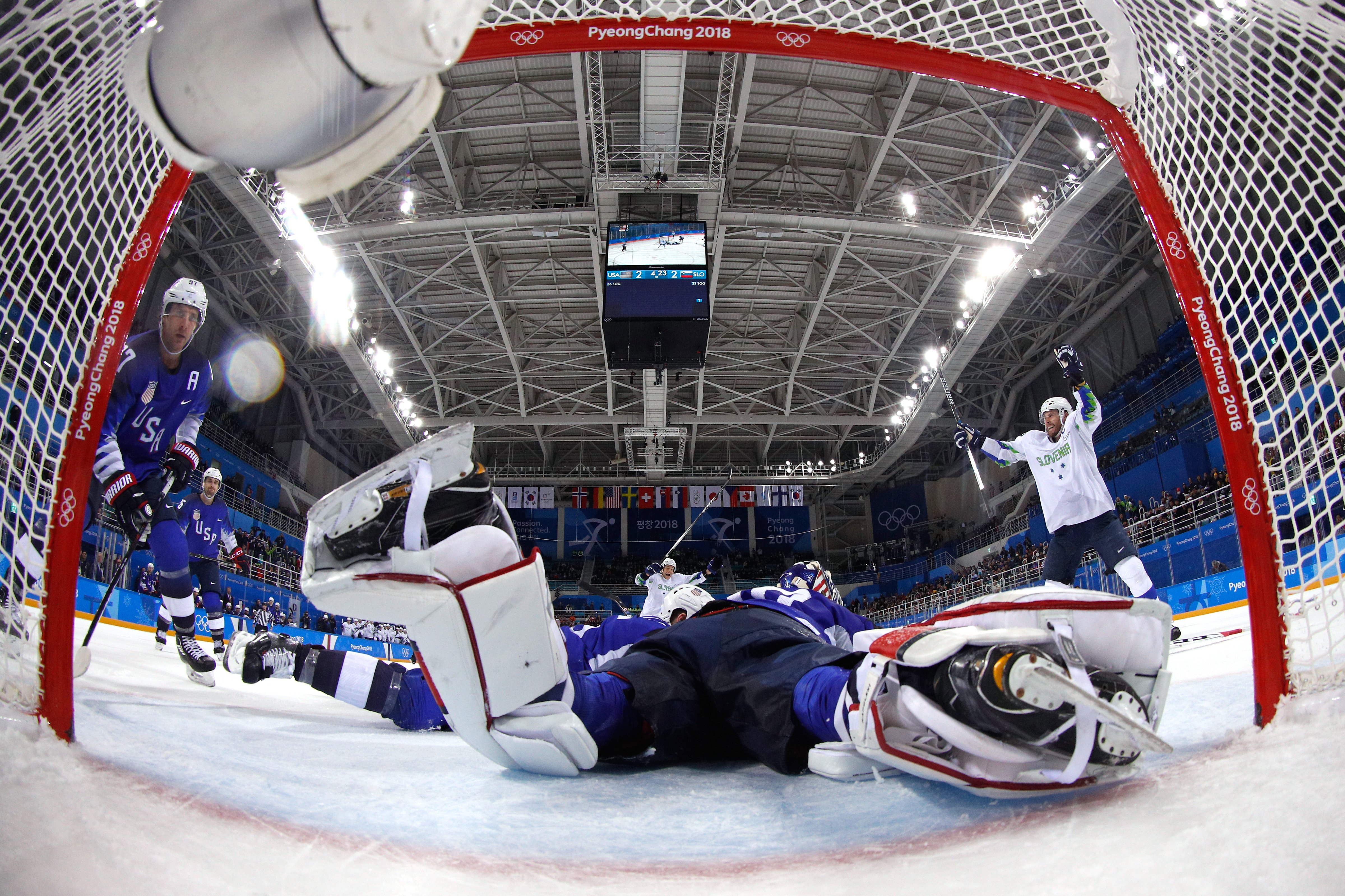 Jan Mursak #39 of Slovenia celebrates after scoring the game winning goal against Ryan Zapolski #30 of the United States in overtime of the Men's Ice Hockey Preliminary Round Group B game on day five of the PyeongChang 2018 Winter Olympics at Kwandong Hockey Centre on February 14, 2018 in Gangneung, South Korea. (Pool—Getty Images)