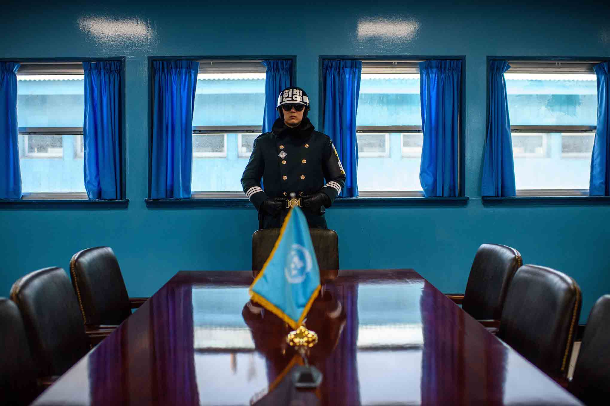 A South Korean soldier stands guard inside a Joint Security Area conference room at the border village of Panmunjom in the Demilitarized Zone between South and North Korea on Feb. 7, 2018. (Carl Court—Getty Images)